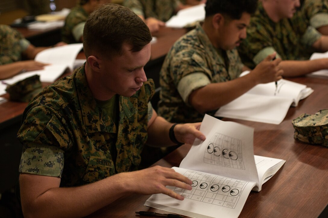 U.S. Marines learn how to teach Marines moving target engagement techniques as part of the Combat Marksmanship Coach Course at Range at 116A on Marine Corps Base Camp Pendleton, California, May 11, 2022. Camp Pendleton’s Marksmanship Training Division trains 22,000 Marines and sailors each year across the installation to effectively engage targets with both rifles and pistols. The Combat Marksmanship Coach course develops Marines to be proficient marksmanship coaches in order to enhance combat effectiveness of the Marine Corps. (U.S. Marine Corps photo by Cpl. Benjamin Whitehurst)