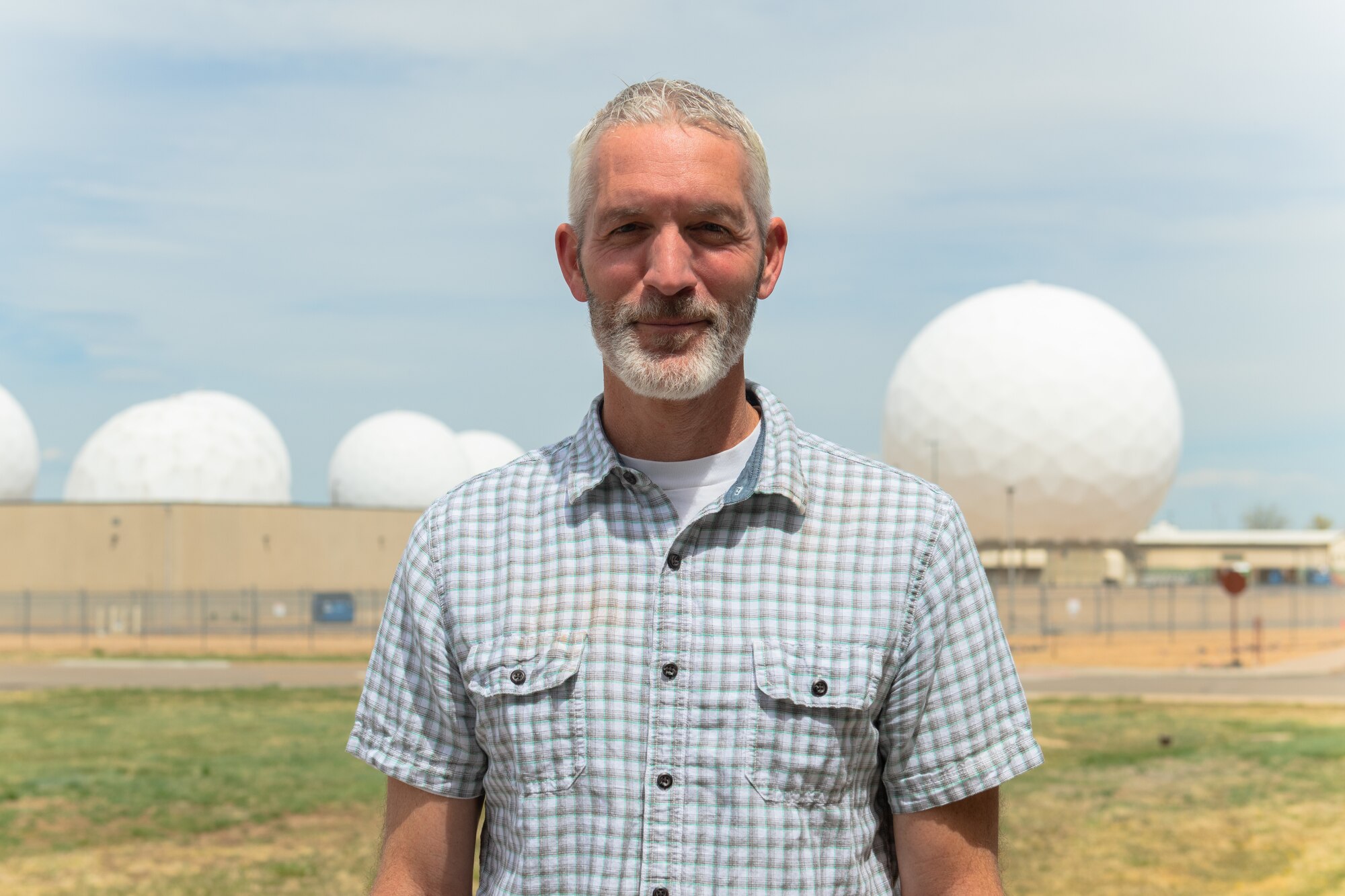 Robert Breland, the Space Delta 4 technical director, stands in front of several radomes located at Buckley Space Force Base, Colo., May 9, 2022