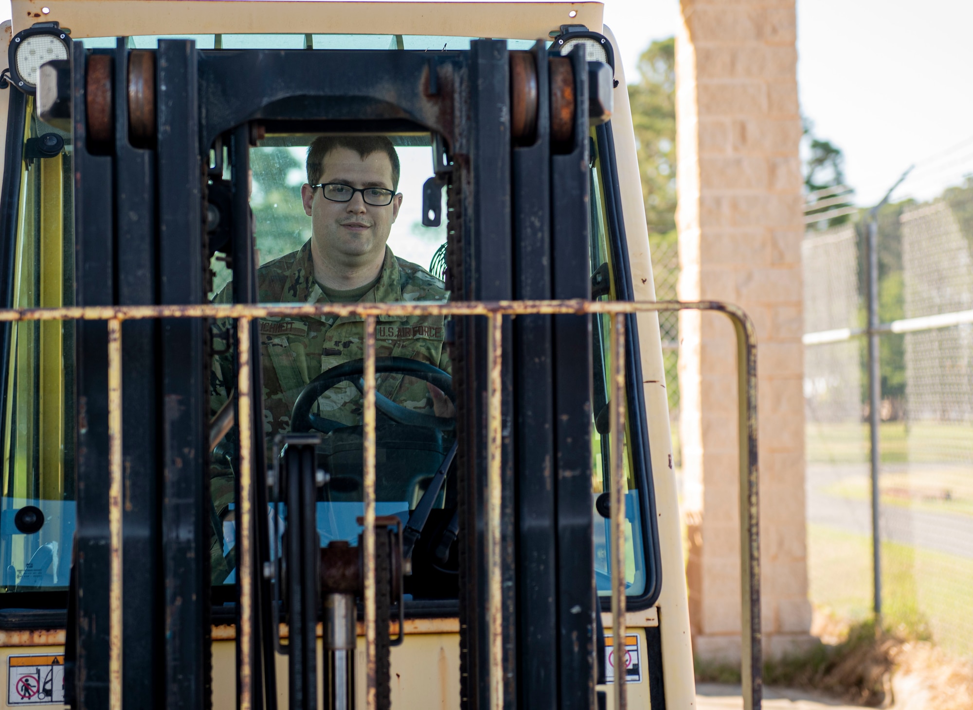 Senior Airman Dylan Buchheit, 4th Logistics Readiness Squadron material management journeyman, drives a forklift at Seymour Johnson Air Force Base, North Carolina, May 17, 2022. The hazardous material shop ensures safe protection of flammable and chemical materials. (U.S. Air Force photo by Airman 1st Class Sabrina Fuller)