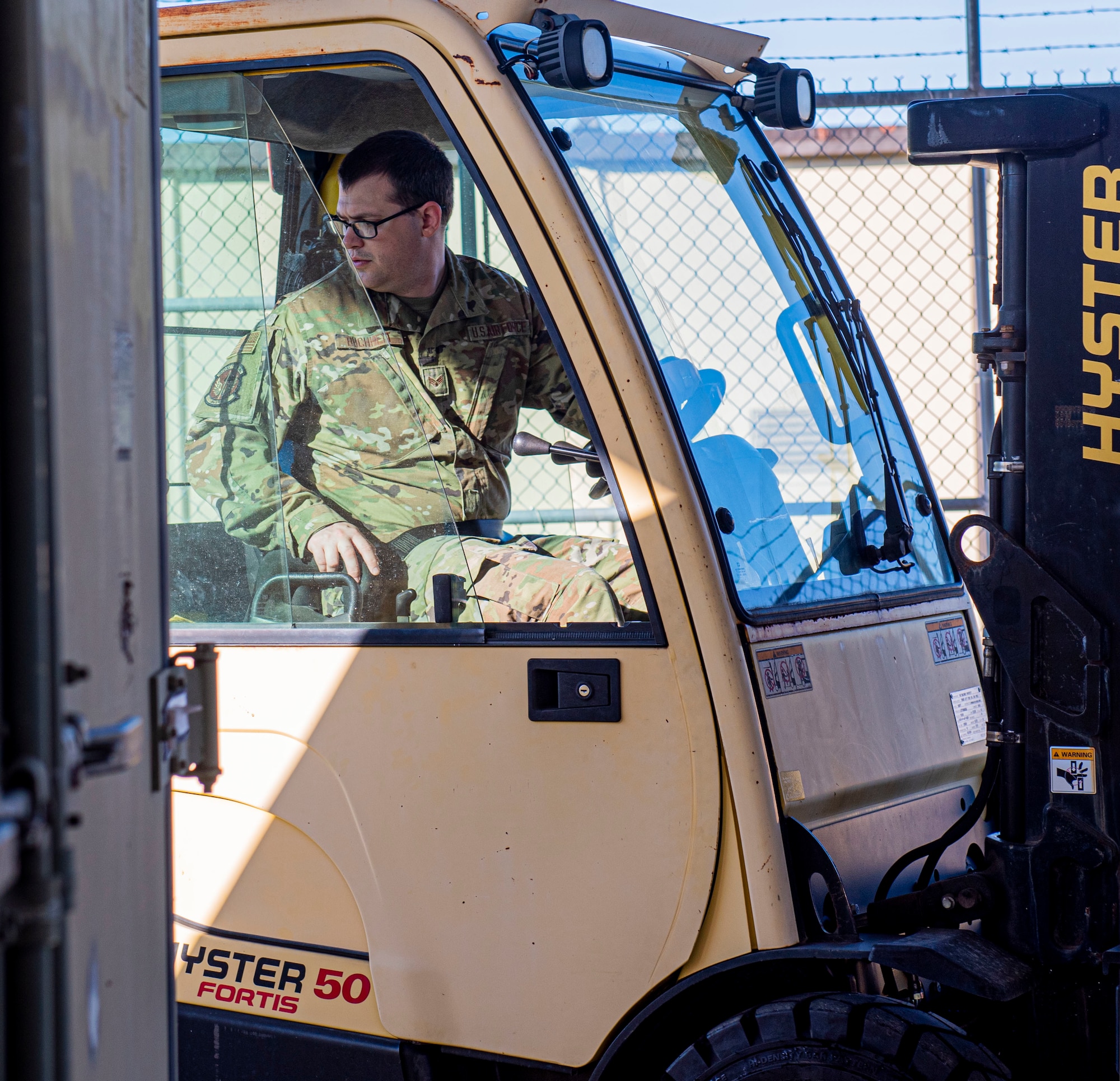 Senior Airman Dylan Buchheit, 4th Logistics Readiness Squadron material management journeyman, drives a forklift at Seymour Johnson Air Force Base, North Carolina, May 17, 2022. The hazardous material shop ensures safe protection of flammable and chemical materials. (U.S. Air Force photo by Airman 1st Class Sabrina Fuller)