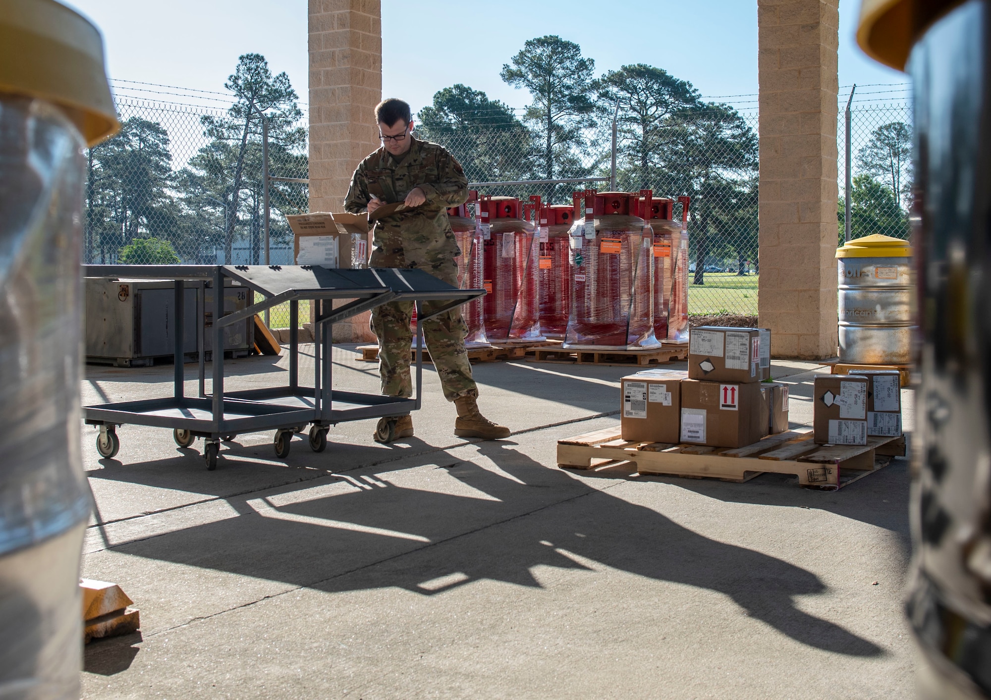 Senior Airman Dylan Buchheit, 4th Logistics Readiness Squadron material management journeyman, unpacks materials at Seymour Johnson Air Force Base, North Carolina, May 17, 2022. Airmen assigned to the hazardous material shop ensure that hazardous materials are properly packaged, marked, labeled and safely stored. (U.S. Air Force photo by Airman 1st Class Sabrina Fuller)