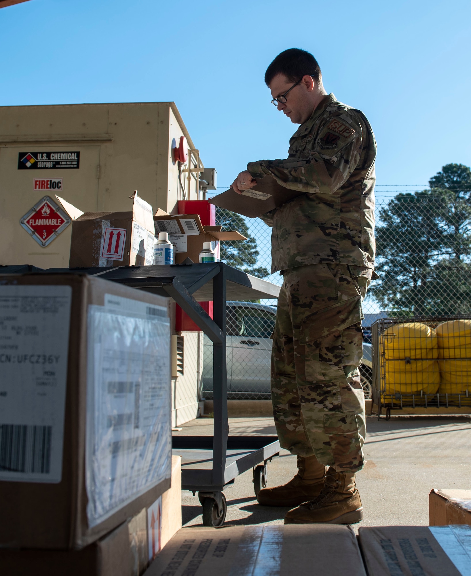 Senior Airman Dylan Buchheit, 4th Logistics Readiness Squadron material management journeyman, unpacks materials at Seymour Johnson Air Force Base, North Carolina, May 17, 2022. Airmen assigned to the hazardous material shop ensure that hazardous materials are properly packaged, marked, labeled and safely stored. (U.S. Air Force photo by Airman 1st Class Sabrina Fuller)