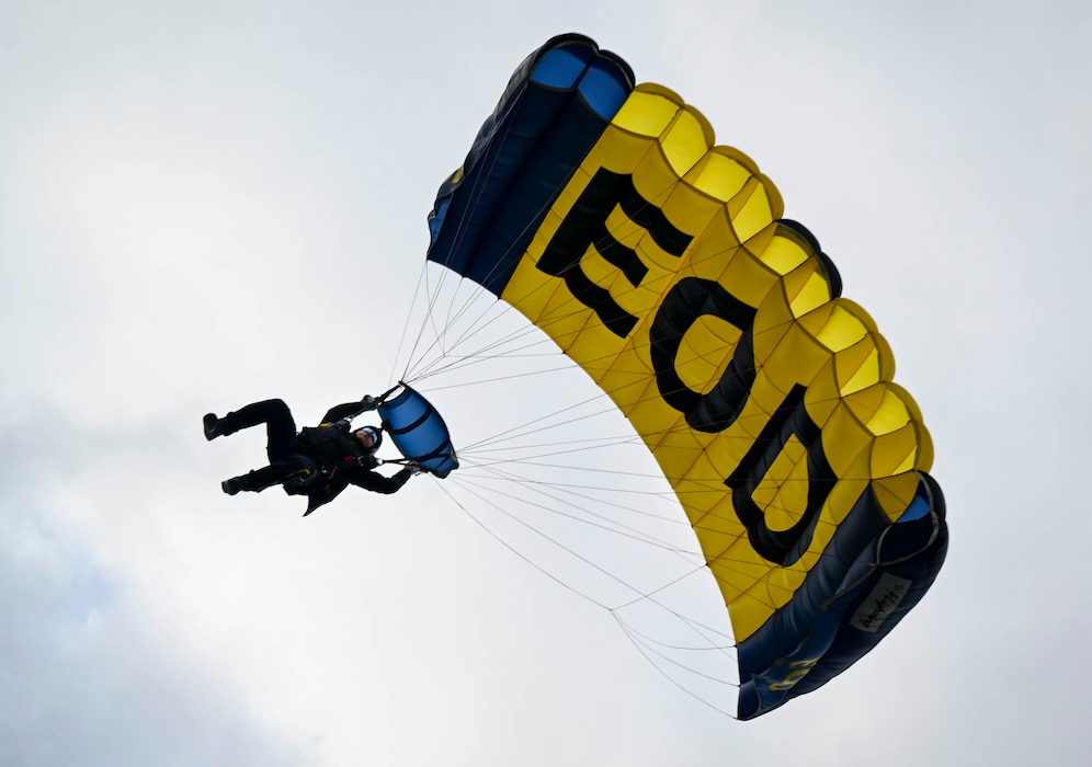 Navy Parachute Team, the “Leap Frogs,” parachutes onto the MetLife Stadium