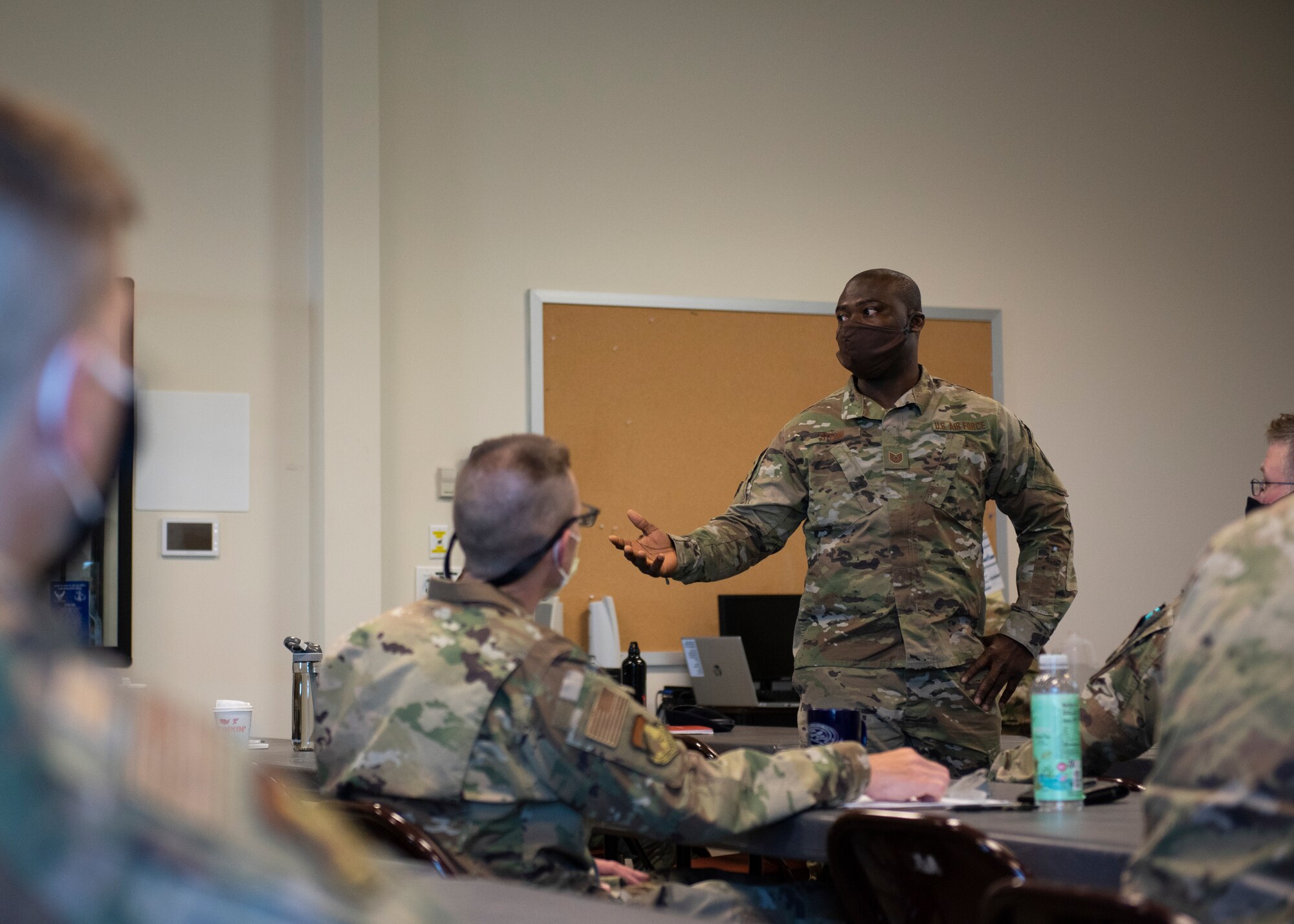 Tech. Sgt. Anthony Stemn, an Airman from the 102nd Intelligence Wing, talks to his fellow participants of the Additional Duty First Sergeant Course on Otis Air National Guard Base, Massachusetts, May 10, 2022. Participants included Guardians and Airmen from the 102nd Intelligence Wing, 104th Fighter Wing, 105th Airlift Wing and the 6th Space Warning Squadron. (U.S. Air National Guard photo by Airman 1st Class Francesca Skridulis)