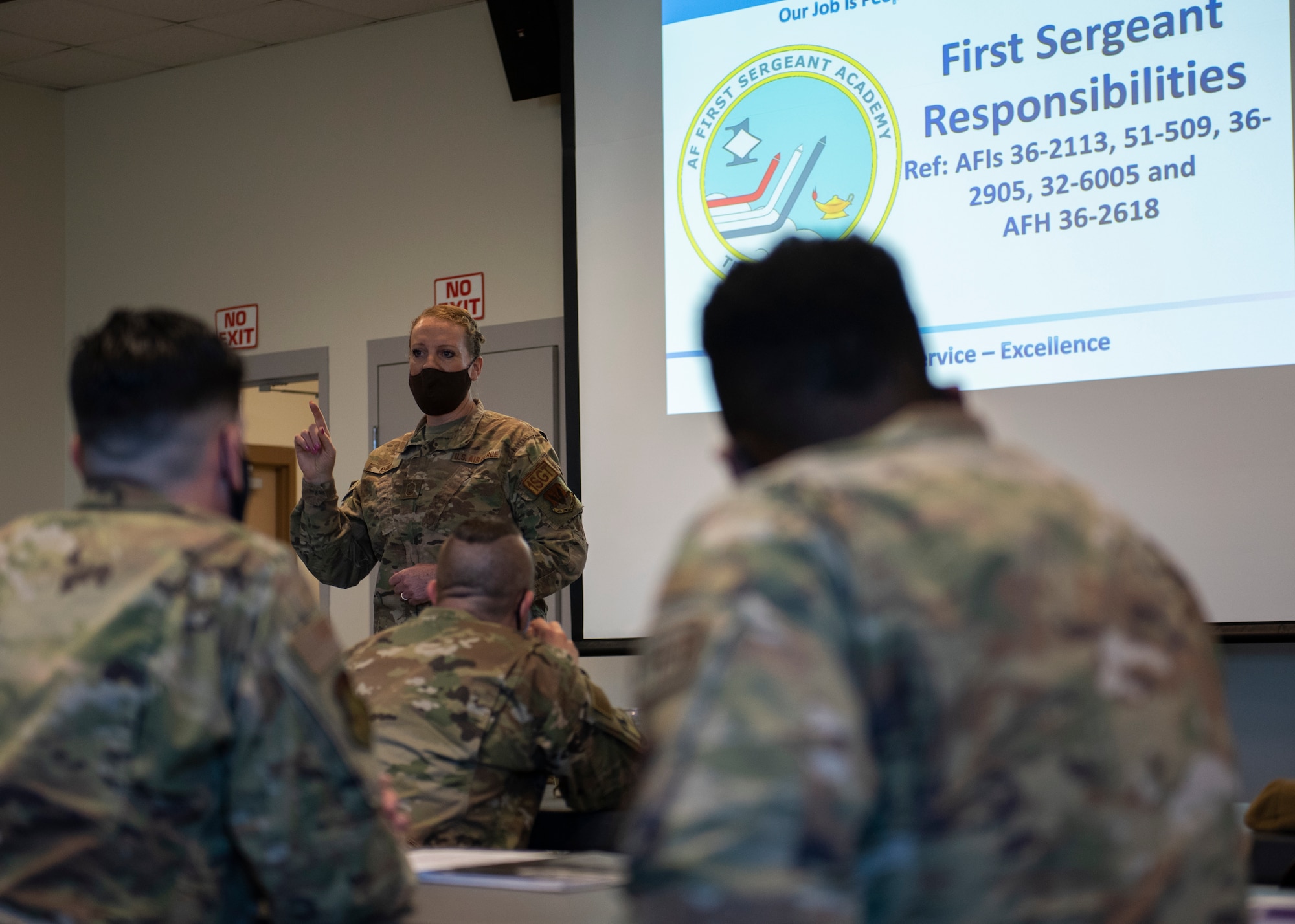 Senior Master Sgt. Victoria Kenny, the 102nd Intelligence Wing First Sergeant, discusses the importance of taking care of fellow Airmen, Guardians and their families in being an effective leader during the Joint Force Additional Duty First Sergeant Course, on Otis Air National Guard Base, Massachusetts, May 10, 2022. Attendees were taught to understand the responsibility of a first sergeant to respond to the needs of unit members 24 hours a day, 7 days a week. (U.S. Air National Guard photo by Airman 1st Class Francesca Skridulis)
