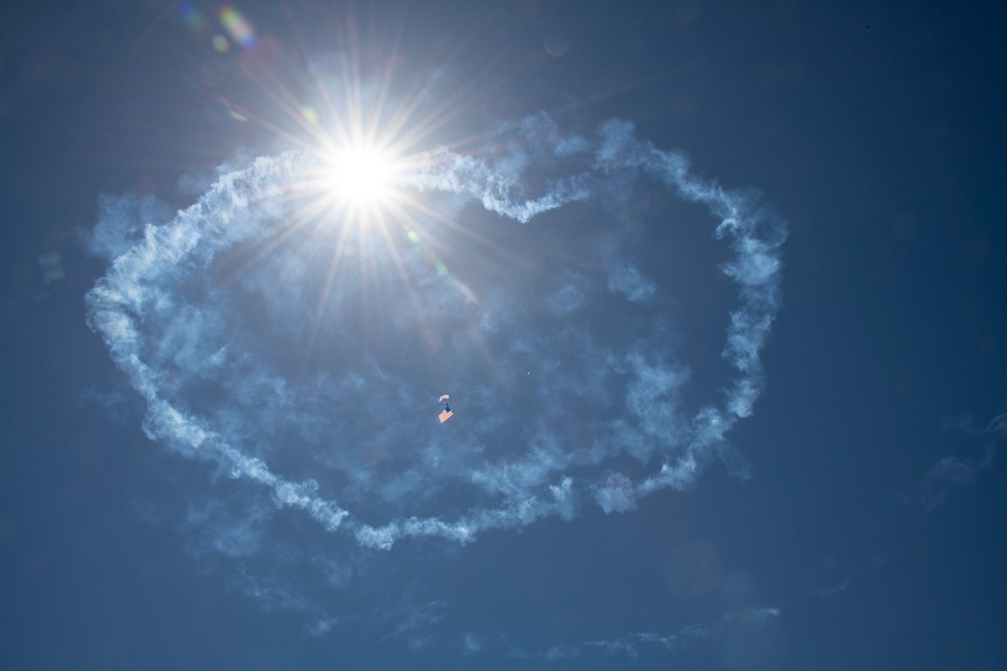 A Wings of Blue members parachutes down to the ground