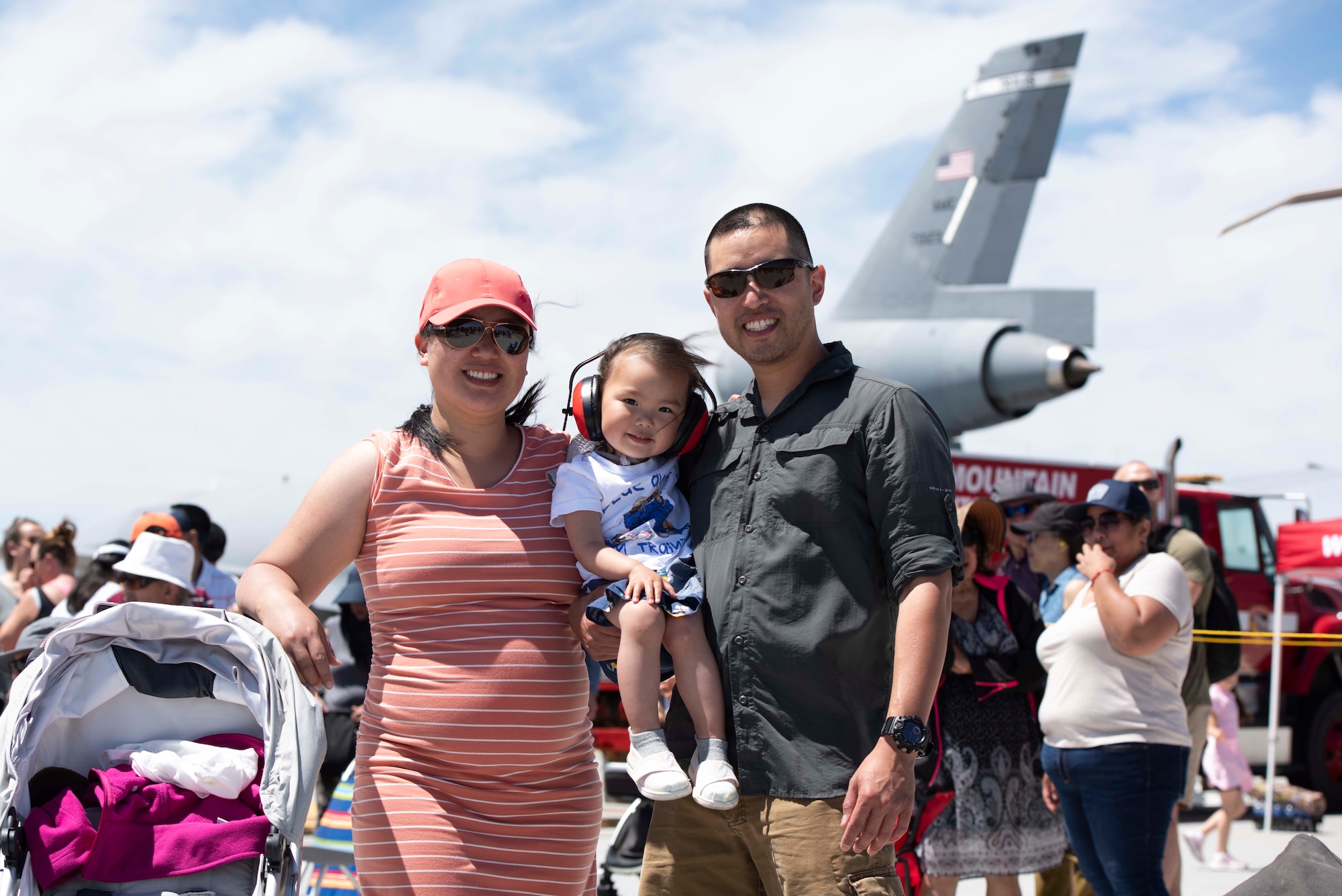 Family gathers for photo at an air show