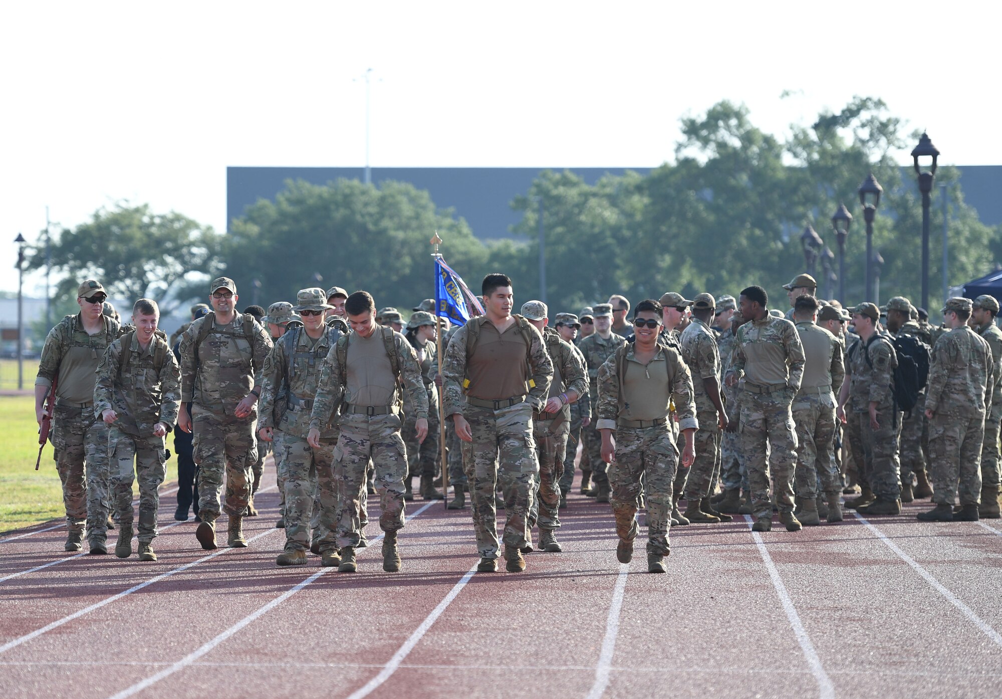 Keesler personnel participate in the Police Week ruck march on the triangle track at Keesler Air Force Base, Mississippi, May 16, 2022. The event was held during National Police Week, recognizing the men and women in law enforcement. (U.S. Air Force photo by Kemberly Groue)