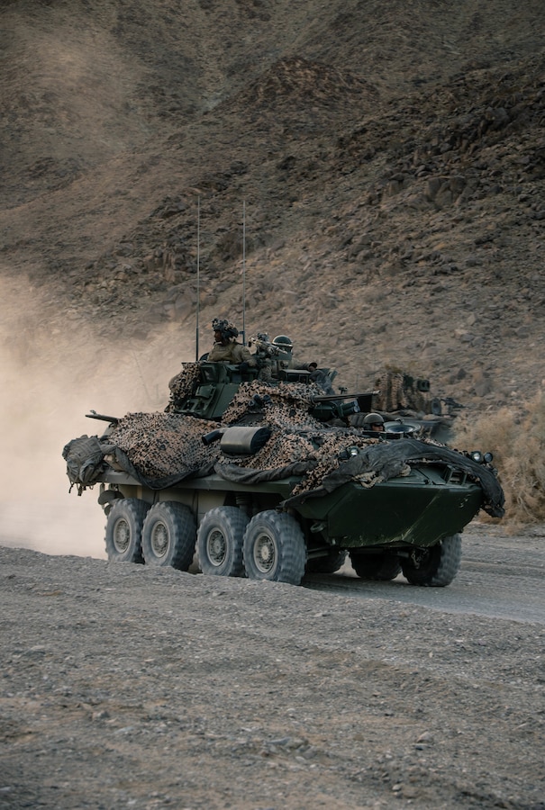 U.S. Marines with Bravo Company, 3d Light Armored Reconnaissance Battalion, 1st Marine Division, participate in a resupply movement during Marine Air Ground Task Force Warfighting Exercise (MWX) 3-22 at Marine Corps Air Ground Combat Center Twentynine Palms, California, May 3, 2022. MWX is a force-on-force exercise that challenges the Division to fight at scale against a free-thinking adversary. (U.S. Marine Corps photo by Sgt. Destiny Dempsey)