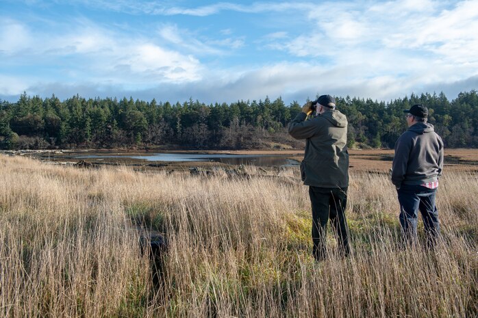 PORT HADLOCK, Wash. (Dec. 13, 2019) Admiralty Audubon Society member John Church, left, and Naval Magazine Indian Island Biologist Bill Kalina, right, spot coyotes during the conservation society’s annual Christmas Bird Count. The Admiralty Audubon Society, a National Audubon Society chapter formed in 1978, serves Port Townsend and the communities of eastern Jefferson County, Washington. (U.S. Navy photo by Mass Communication Specialist 3rd Class Emilia Hilliard)