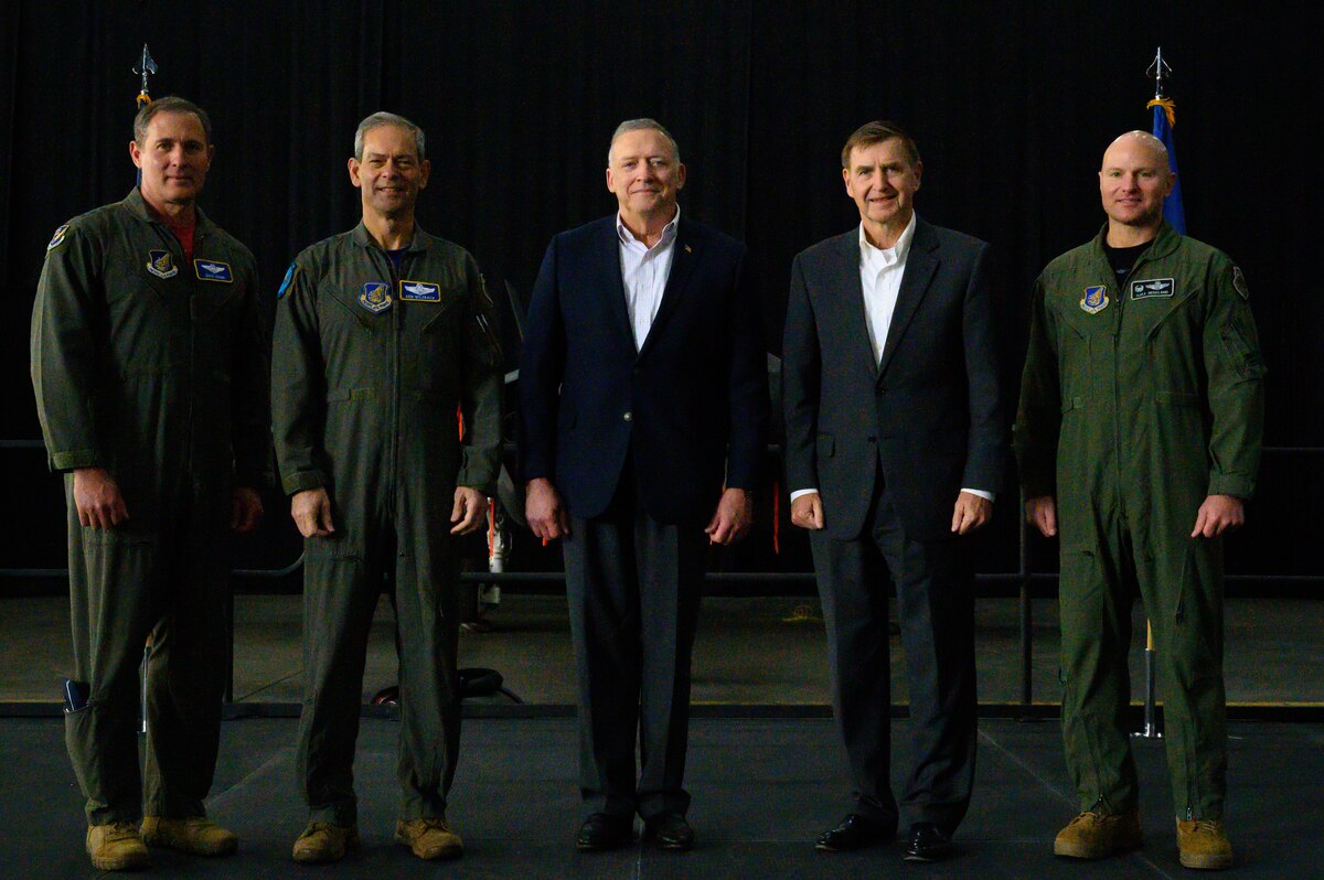 U.S. Air Force Col. David Berkland, 354th Fighter Wing commander (right), poses with representatives from U.S. Indo-Pacific Command  and Lockheed Martin at the Last Jet Arrival Ceremony May 13, 2022, on Eielson Air Force Base, Alaska.