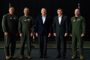 U.S. Air Force Col. David Berkland, 354th Fighter Wing commander (right), poses with representatives from U.S. Indo-Pacific Command  and Lockheed Martin at the Last Jet Arrival Ceremony May 13, 2022, on Eielson Air Force Base, Alaska.