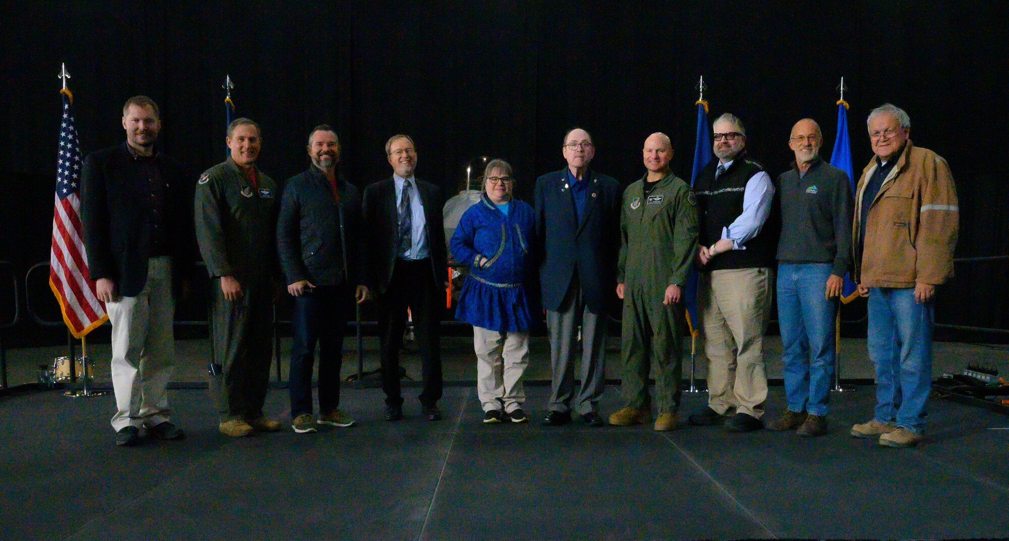 U.S. Air Force Col. David Berkland, 354th Fighter Wing commander (fourth from right), poses with representatives from U.S. Pacific Air Forces, 11th Air Force, Lockheed Martin, and local Alaska communities at the 354th Fighter Wing’s Last Jet Arrival Ceremony May 13, 2022, on Eielson Air Force Base, Alaska.