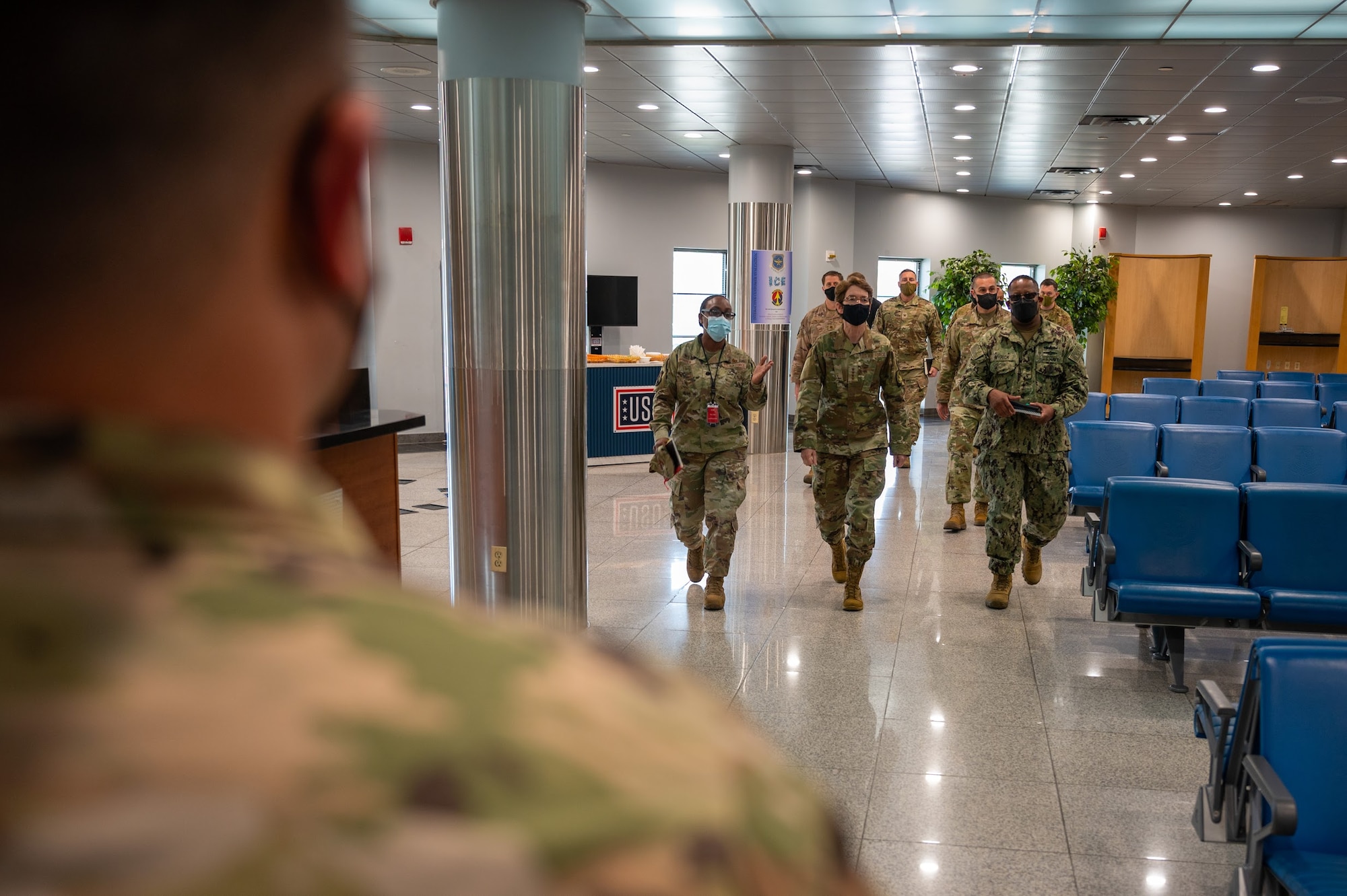 U.S. Air Force Gen. Jacqueline D. Van Ovost, commander, U.S. Transportation Command (USTRANSCOM), and U.S. Navy Fleet Master Chief Donald Myrick, senior enlisted leader, USTRANSCOM, tour the Osan Passenger Terminal, May 17, 2022, Osan Air Base, Republic of Korea. Their visit to the ROK was one of many across the INDOPACOM area of responsibility. (U.S. Air Force photo by Tech. Sgt. Zachariah Lopez)