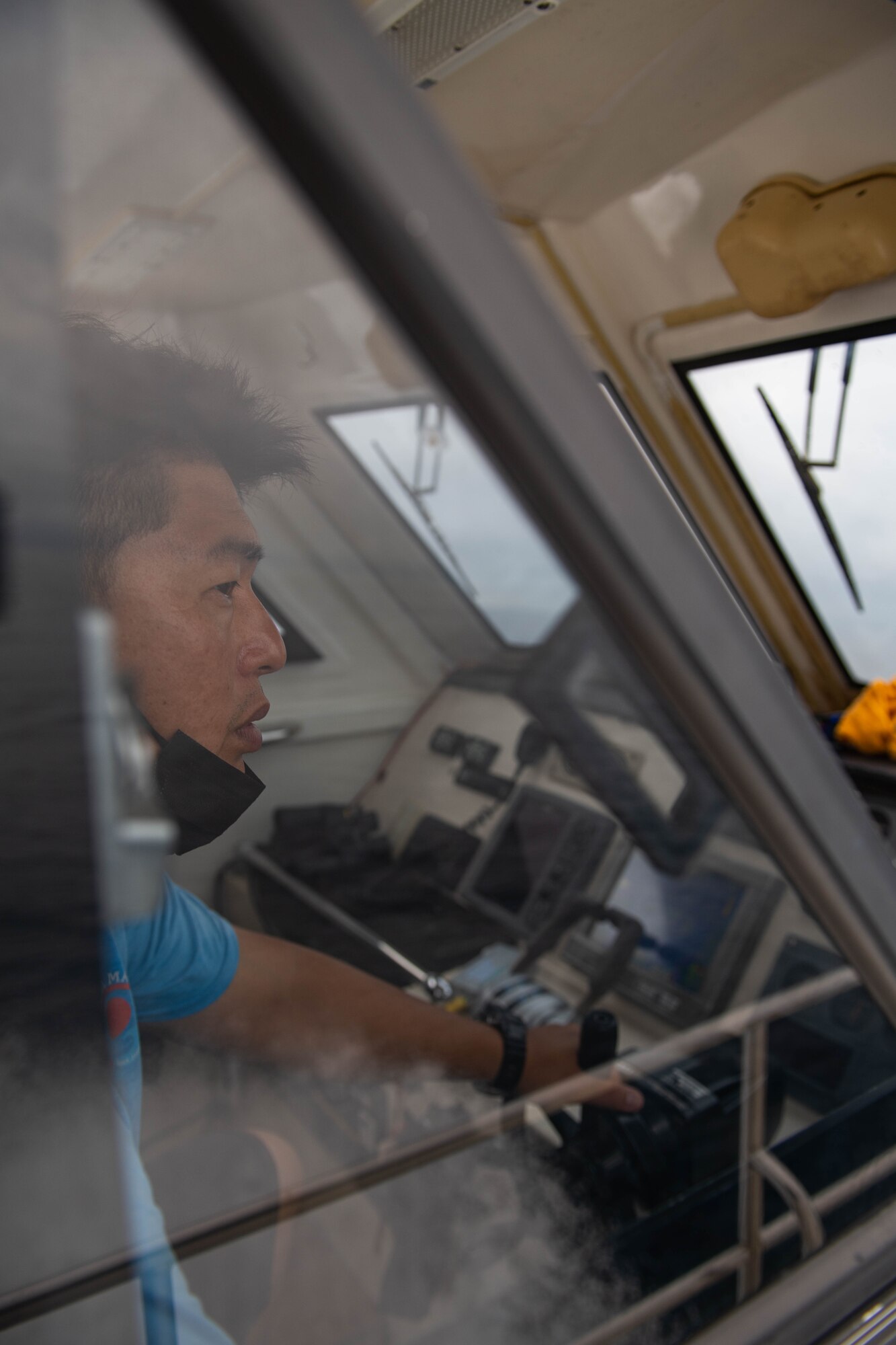 A ship captain navigates through the open ocean