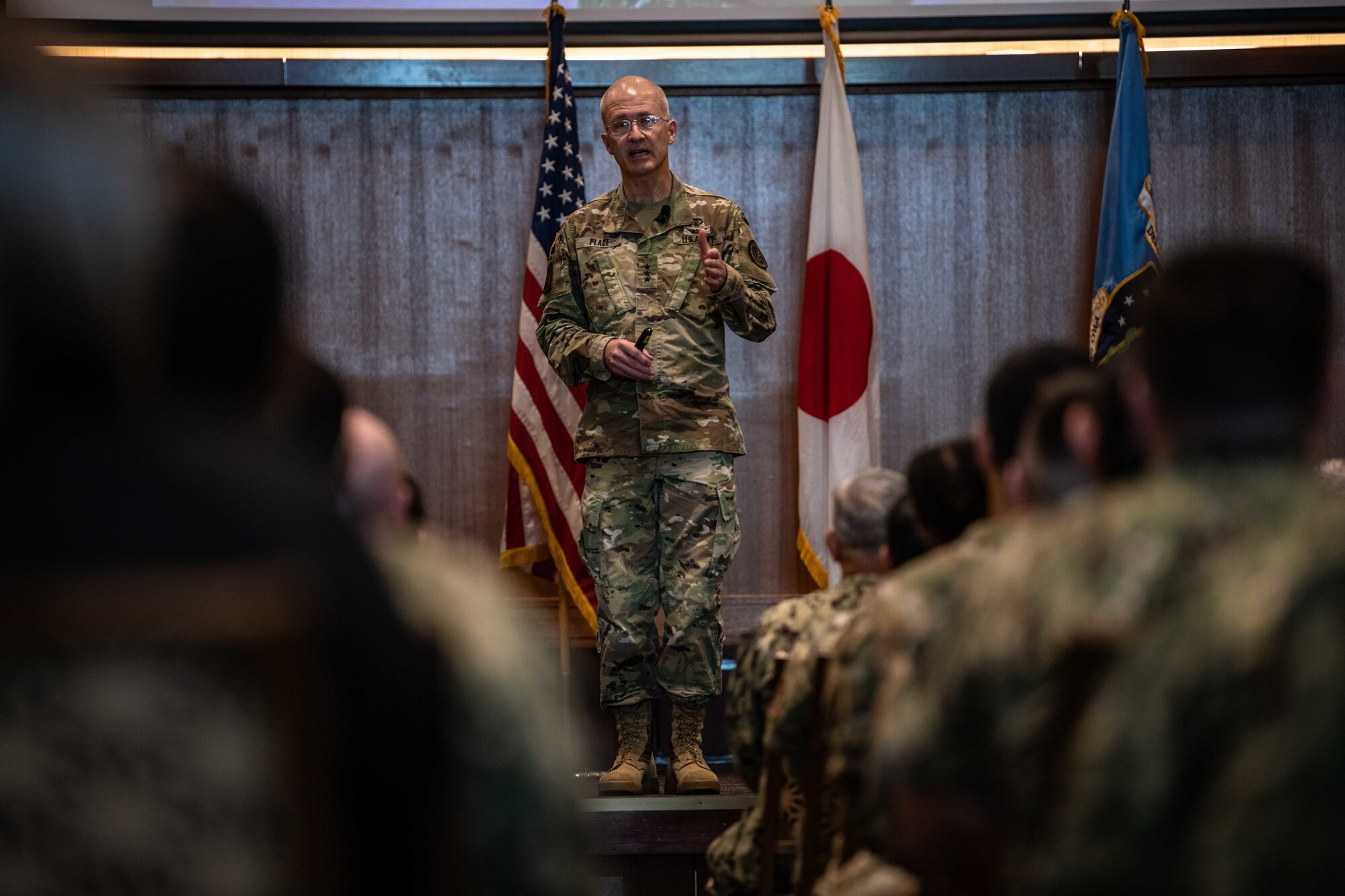 Soldier speaks to an audience.