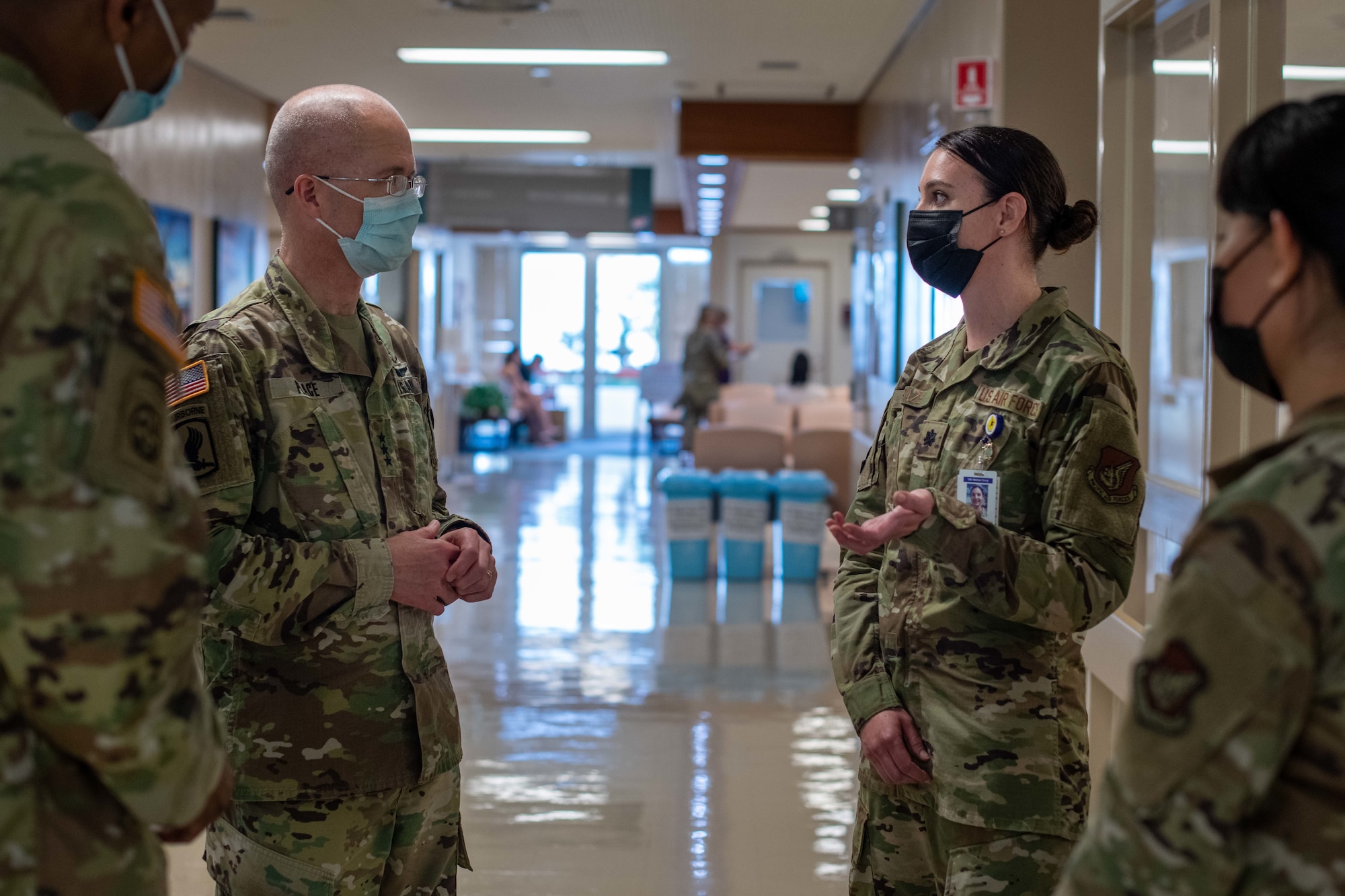 Soldier speaks to an Airman.