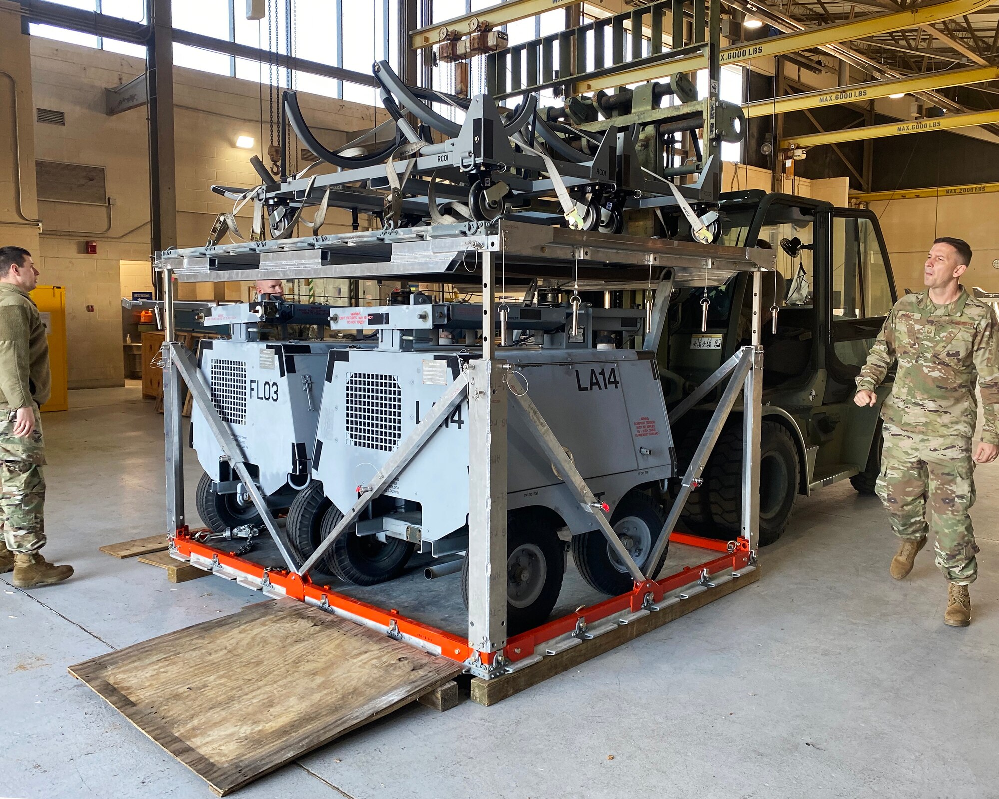 Members of the 147th Attack Wing test a vertical pallet stacking system at Ellington Field JRB, Houston, Texas January 5, 2022.