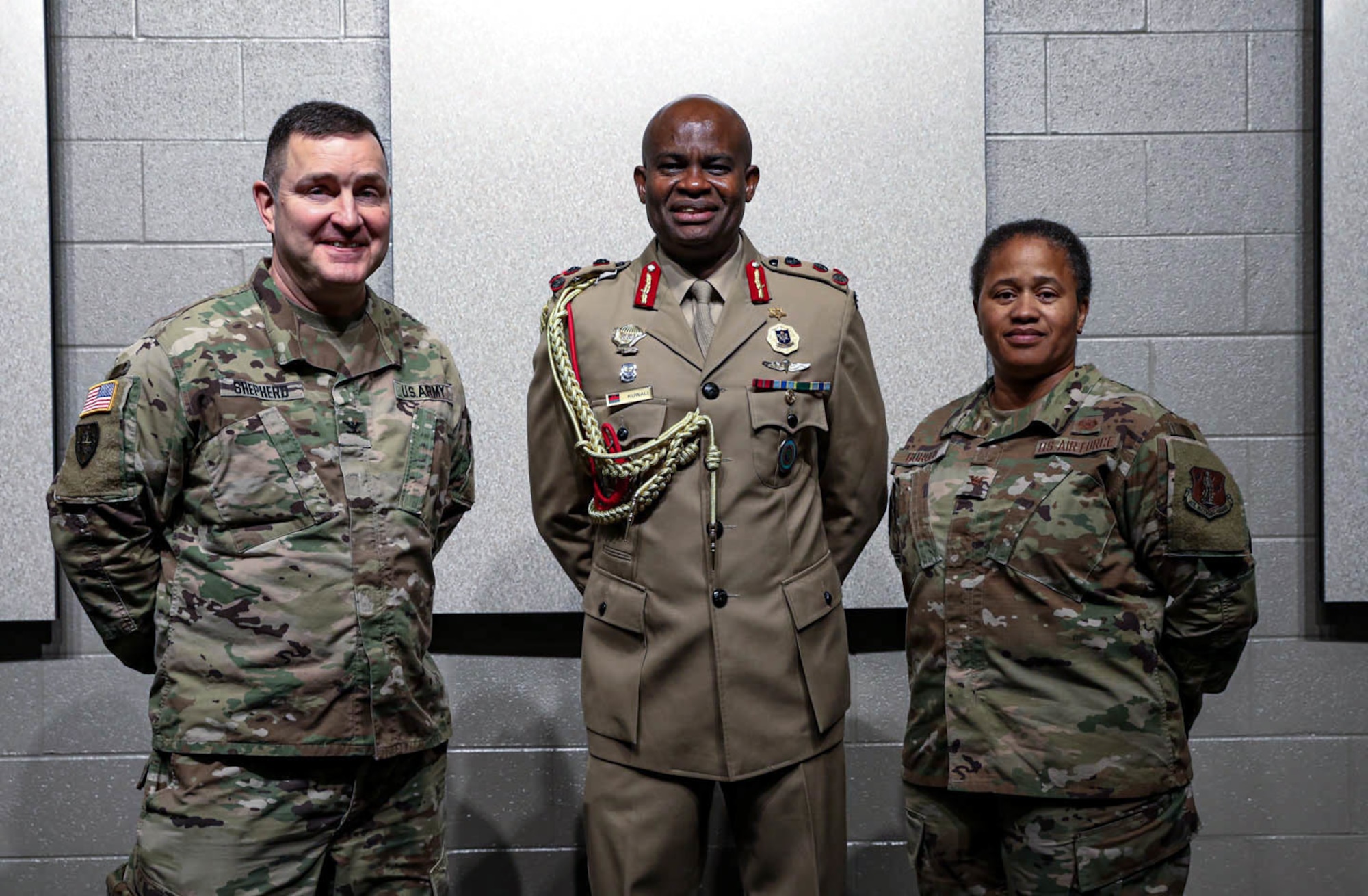 Brig. Gen. Dan Kuwali of the Malawi Defense Force with Kentucky National Guard Cols. Jason Shepherd and Joyce Gordon April 22, 2022, in Frankfort, Ky. Kuwali was invited by the pair to speak to Kentucky National Guard’s staff judge advocates about the opportunities for the United States to use soft power in Africa to balance China's engagements on the continent.