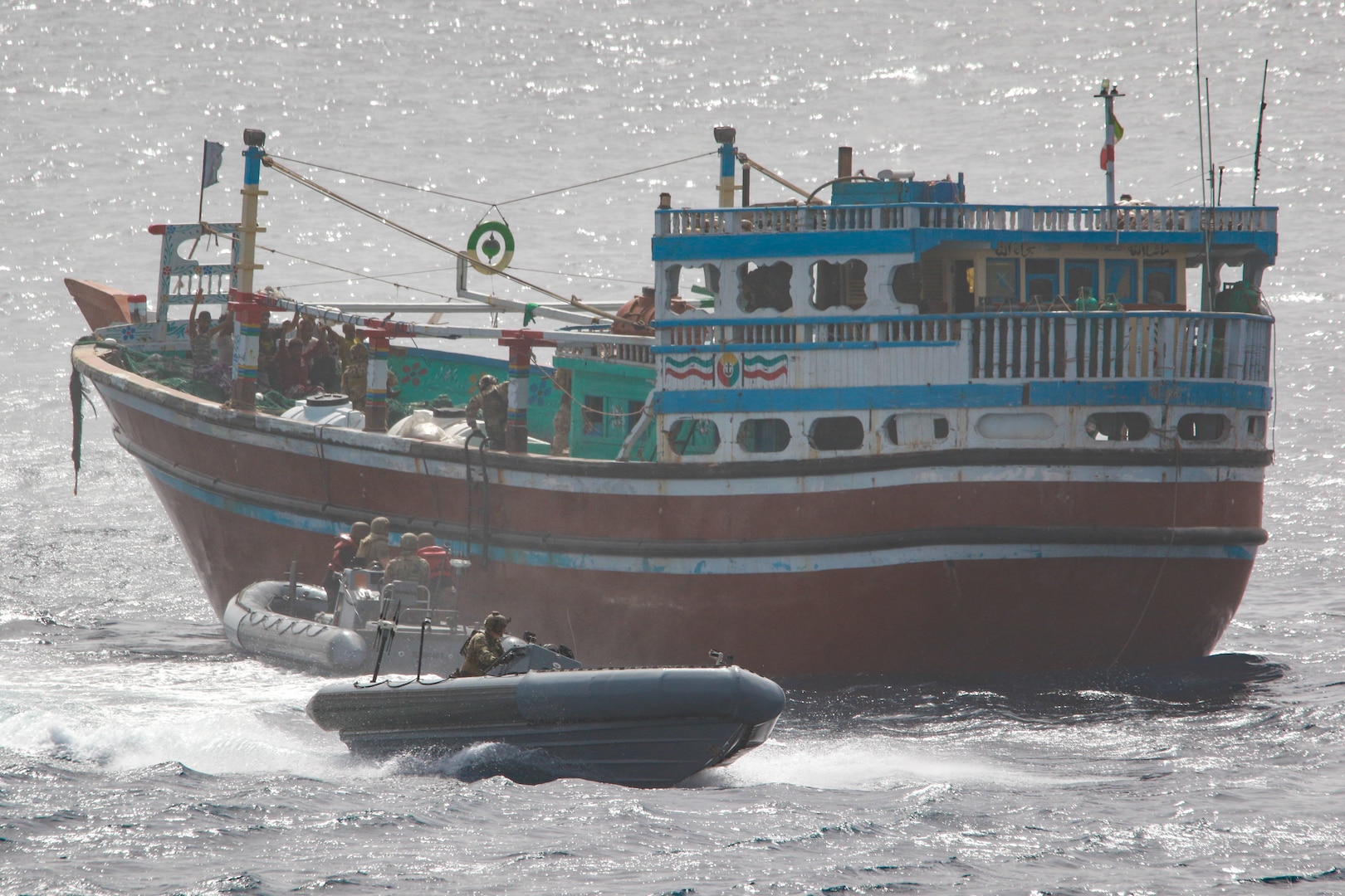 220516-N-TT059-1006 GULF OF OMAN (May 16, 2022) An interdiction team from guided-missile destroyer USS Momsen (DDG 92) boards a fishing vessel May 16. The vessel was seized while transiting international waters in the Gulf of Oman