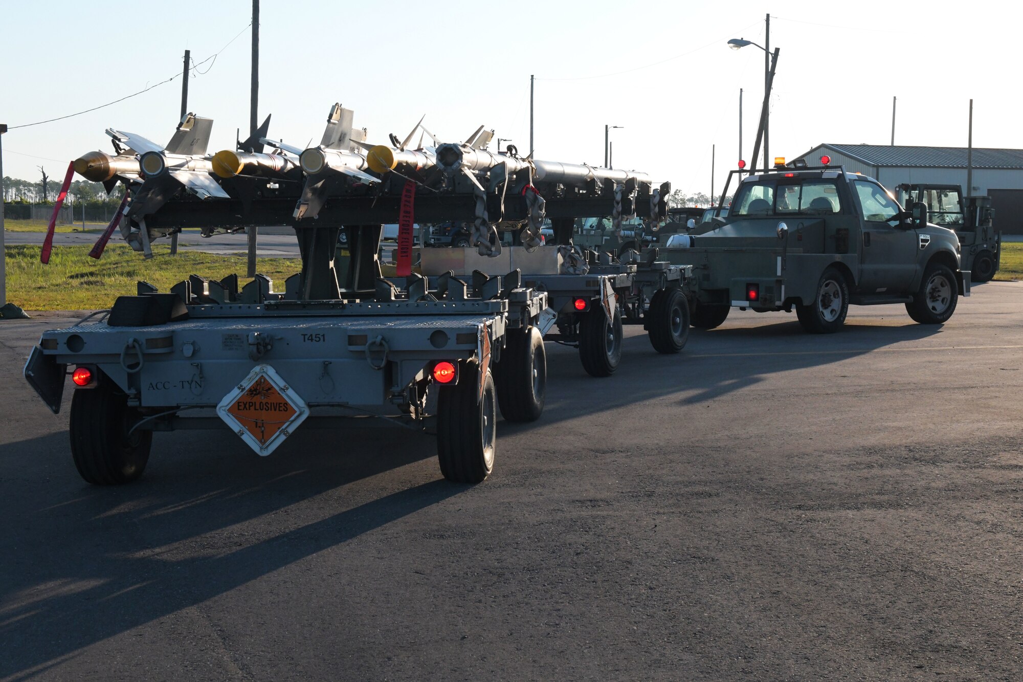 U.S. Airmen with the 325th Munitions Squadron transport AIM-9M Sidewinder missiles at Tyndall Air Force Base, Florida, May 10, 2022.