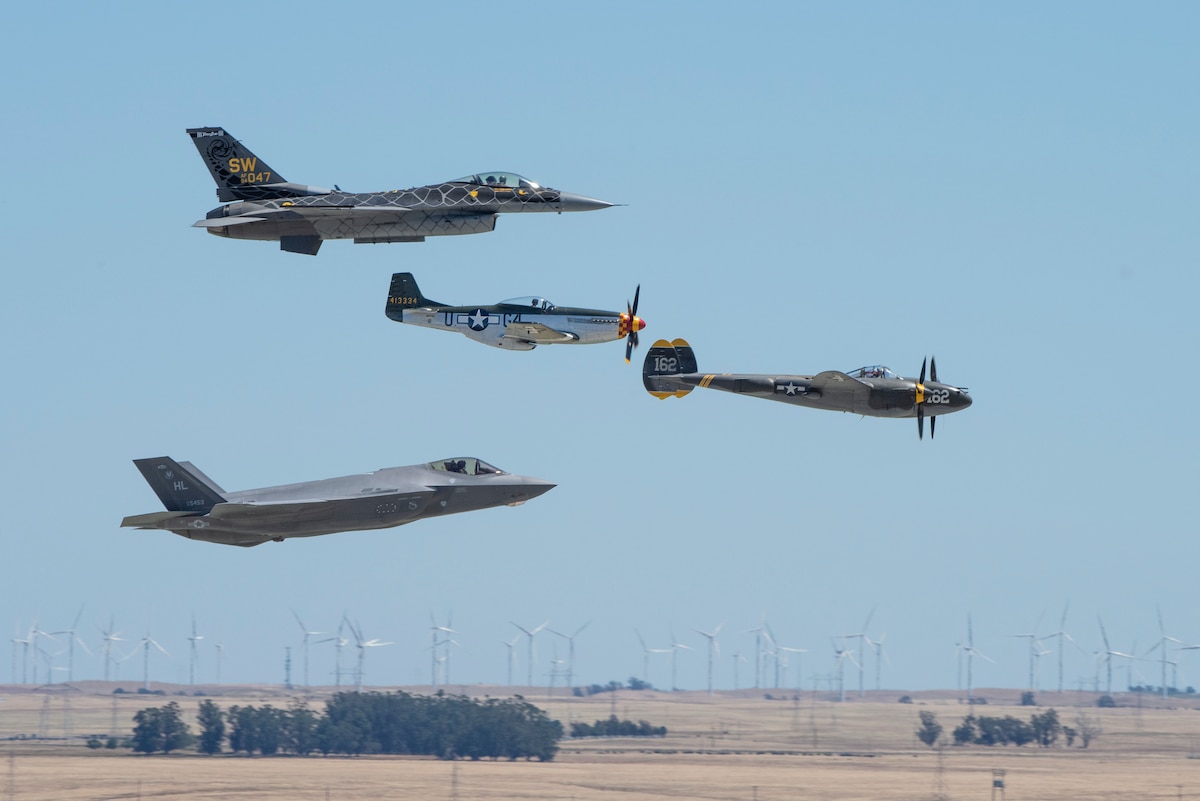 From left to right, a U.S. Air Force F-35A Lightning II, F-16 Viper, P-51 Mustang and P-38 Lightning perform a heritage flight during the air show rehearsal at Travis Air Force Base, Calif., May 13, 2022. The air show rehearsal provided an opportunity for Department of Defense employees and their families to see the installation’s full capabilities. (U.S. Air Force photo by Heide Couch)