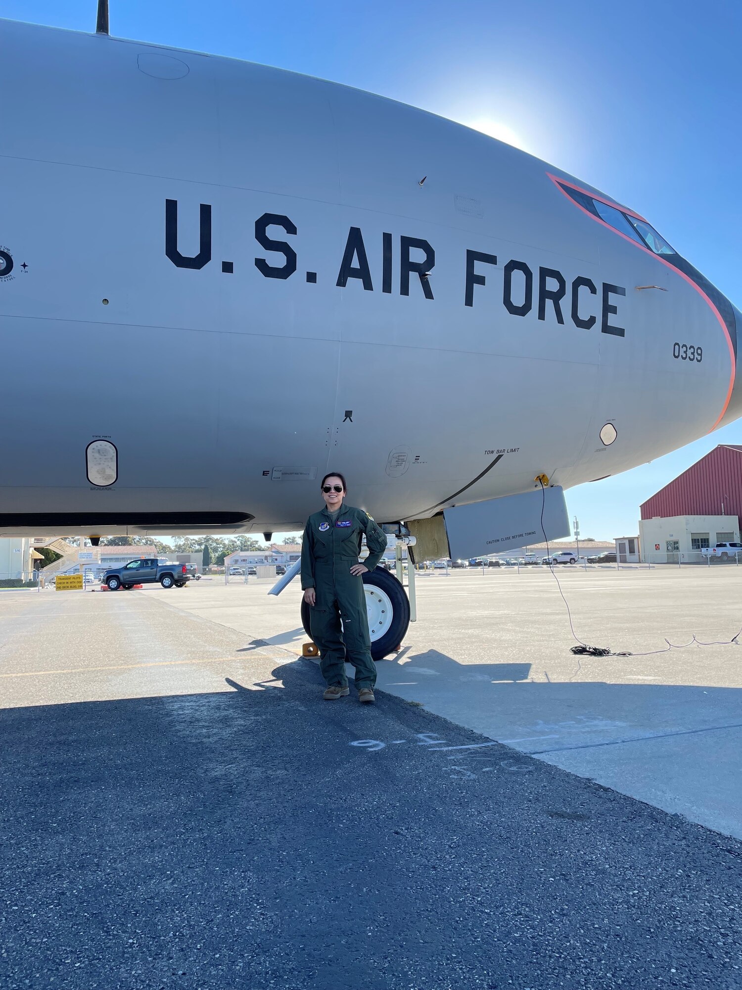 Capt. Geryn Paguio standing in front of a U.S. Air Force plane