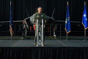 U.S. Air Force Col. David Berkland, 354th Fighter Wing commander (right), poses with representatives from U.S. Indo-Pacific Command  and Lockheed Martin at the Last Jet Arrival Ceremony May 13, 2022, on Eielson Air Force Base, Alaska.