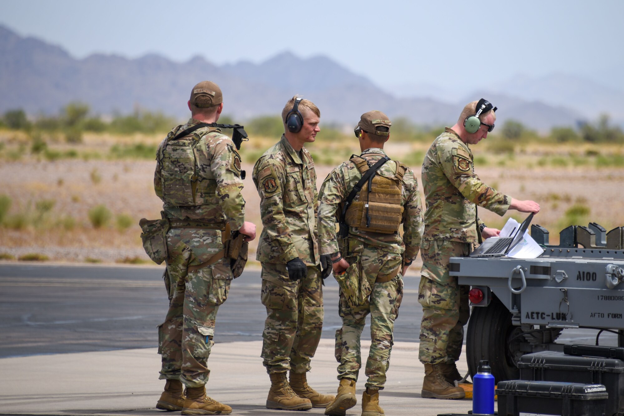 A photo of Airmen performing security on a flight line.