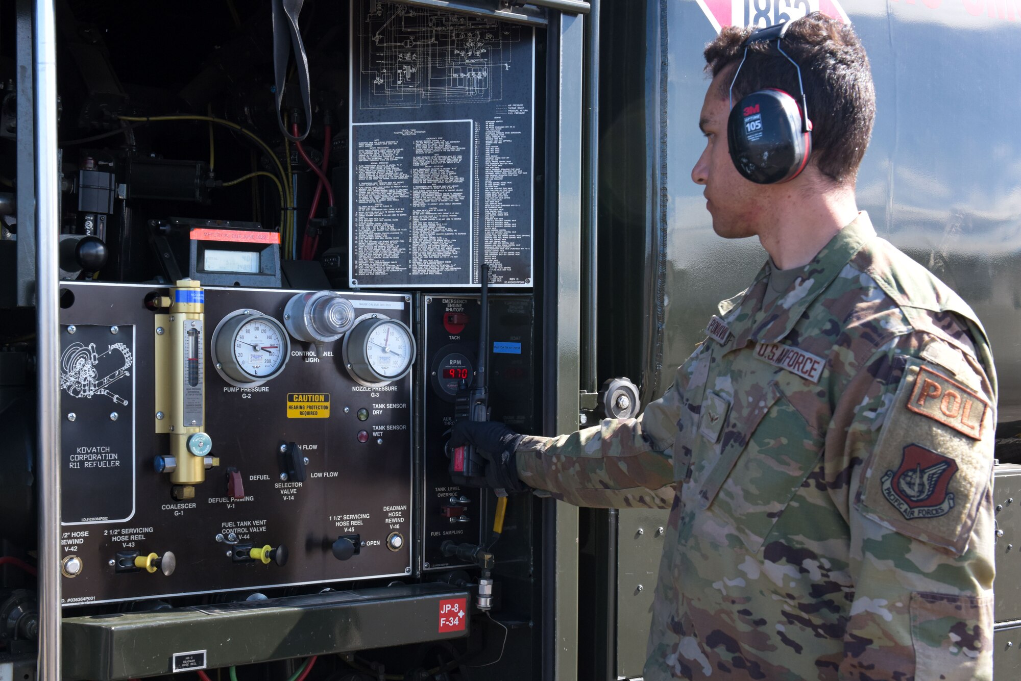 U.S. Air Force Airman Santiago Pompa Rivera, 354th Logistic Readiness Squadron fuels distribution apprentice, watches fuel levels during an F-16 Fighting Falcon refuel in support of RED FLAG-Alaska 22-1 at Eielson Air Force Base, May 4, 2022.