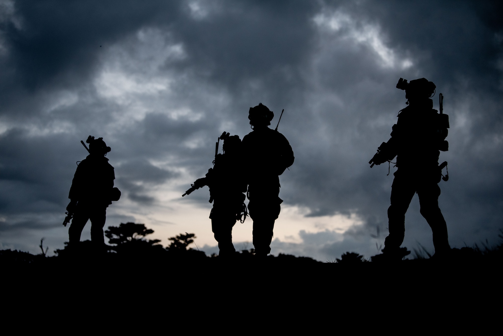 Airmen walk into a mock town.