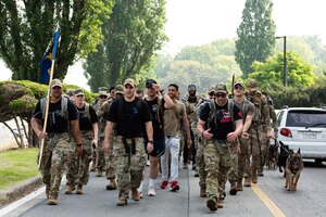 Members of the 51st Security Forces Squadron participate in a ruck march at Osan Air Base, Republic of Korea, May 13, 2022.