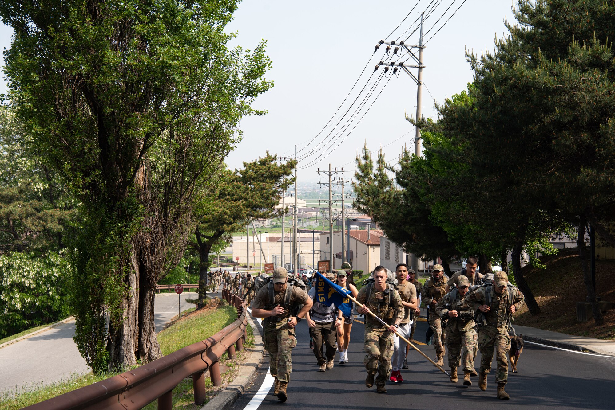 Members of the 51st Security Forces Squadron participate in a ruck march at Osan Air Base, Republic of Korea, May 13, 2022.
