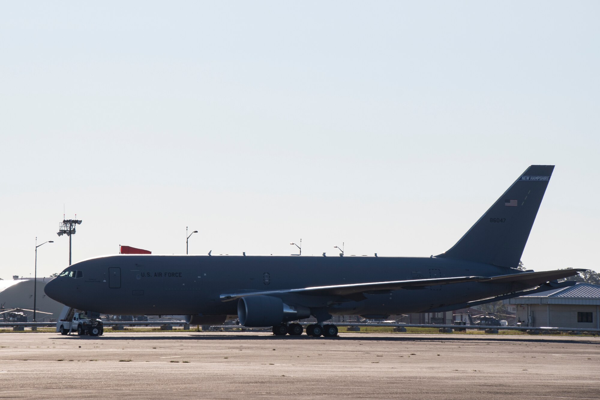 A U.S. Air Force KC-46 Pegasus with the 157th Air Refueling Wing, New Hampshire Air National Guard, sits on the flightline May 11, 2022, at Hunter Army Airfield, Georgia. Three air refueling units from across the Air National Guard provided in-flight refueling in support of Sentry Savannah 2022, the ANG’s premier counter air exercise which encompasses 10 units of fourth and fifth generation fighter aircraft, tests the capabilities of our warfighters in a simulated near-peer environment and trains the next generation of fighter pilots for tomorrow’s fight. (U.S. Air National Guard photo by Staff Sgt. Hanna Smith)