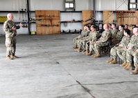 U.S. Army Lt. Col. Patrick Donnelly, Task Force Powderhorn senior leader, addresses Airmen during the TF Powderhorn awards ceremony at Barnes Air National Guard Base, Massachusetts, May 14, 2022. Fifty four Barnestormers were awarded Army Achievement Medals for their outstanding performance during TF Powderhorn, an activation where members supported state medical facilities. (U.S. Air National Guard Photo by Senior Airman Camille Lienau)