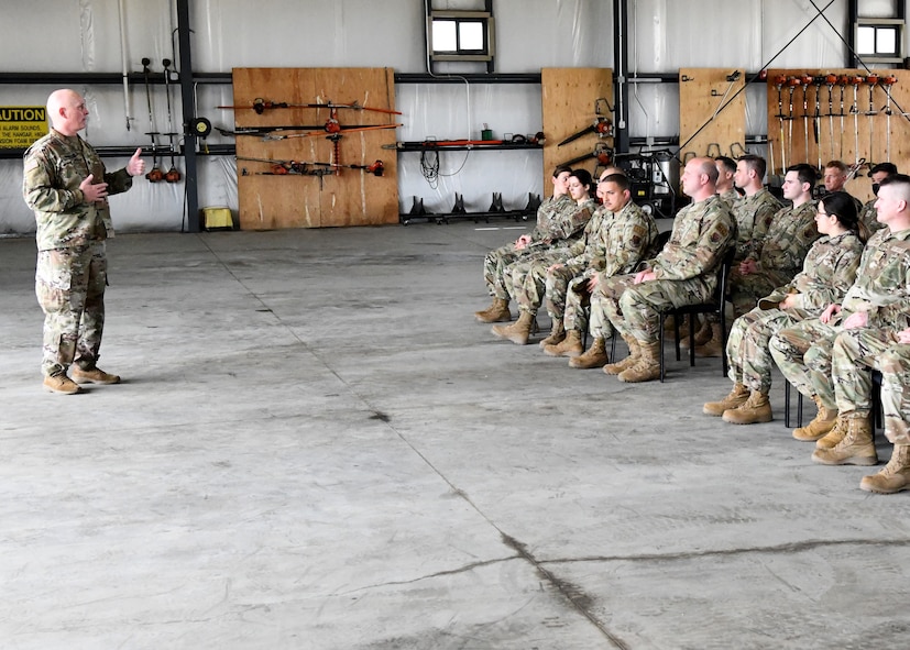 U.S. Army Lt. Col. Patrick Donnelly, Task Force Powderhorn senior leader, addresses Airmen during the TF Powderhorn awards ceremony at Barnes Air National Guard Base, Massachusetts, May 14, 2022. Fifty four Barnestormers were awarded Army Achievement Medals for their outstanding performance during TF Powderhorn, an activation where members supported state medical facilities. (U.S. Air National Guard Photo by Senior Airman Camille Lienau)