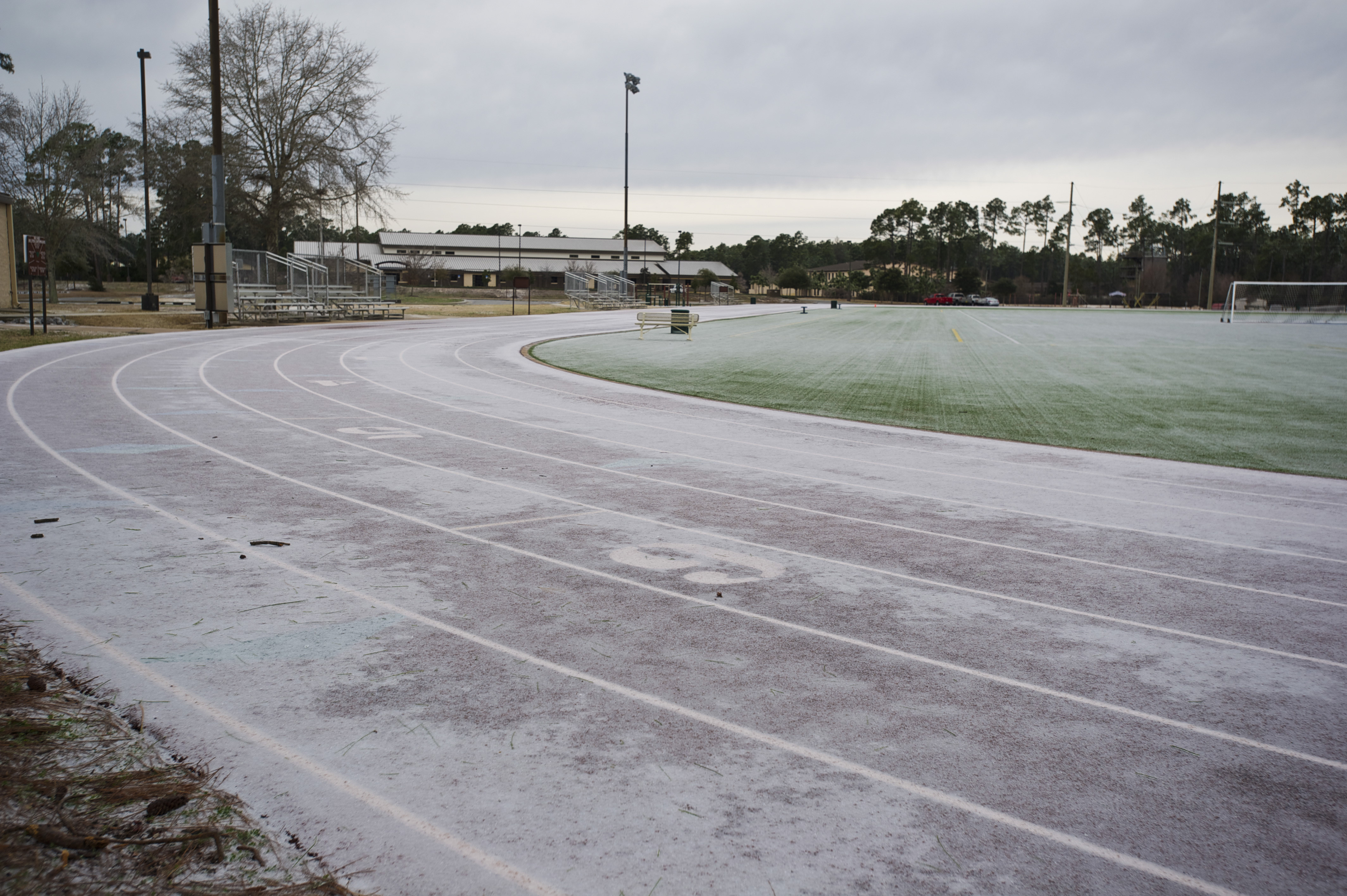 Frost and ice cover the track and field at the Aderholt Fitness Center at Hurlburt Field, Fla.,