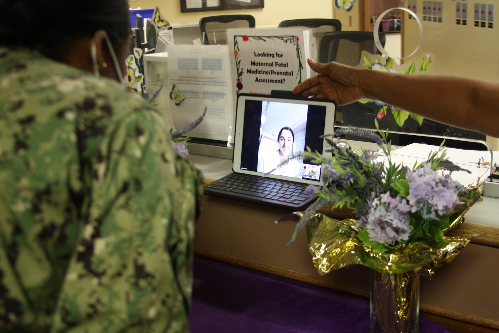 Nurse accepts award using a mobile device