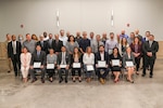 NSWC IHD employees who received Command Honorary Awards pose for a group picture.