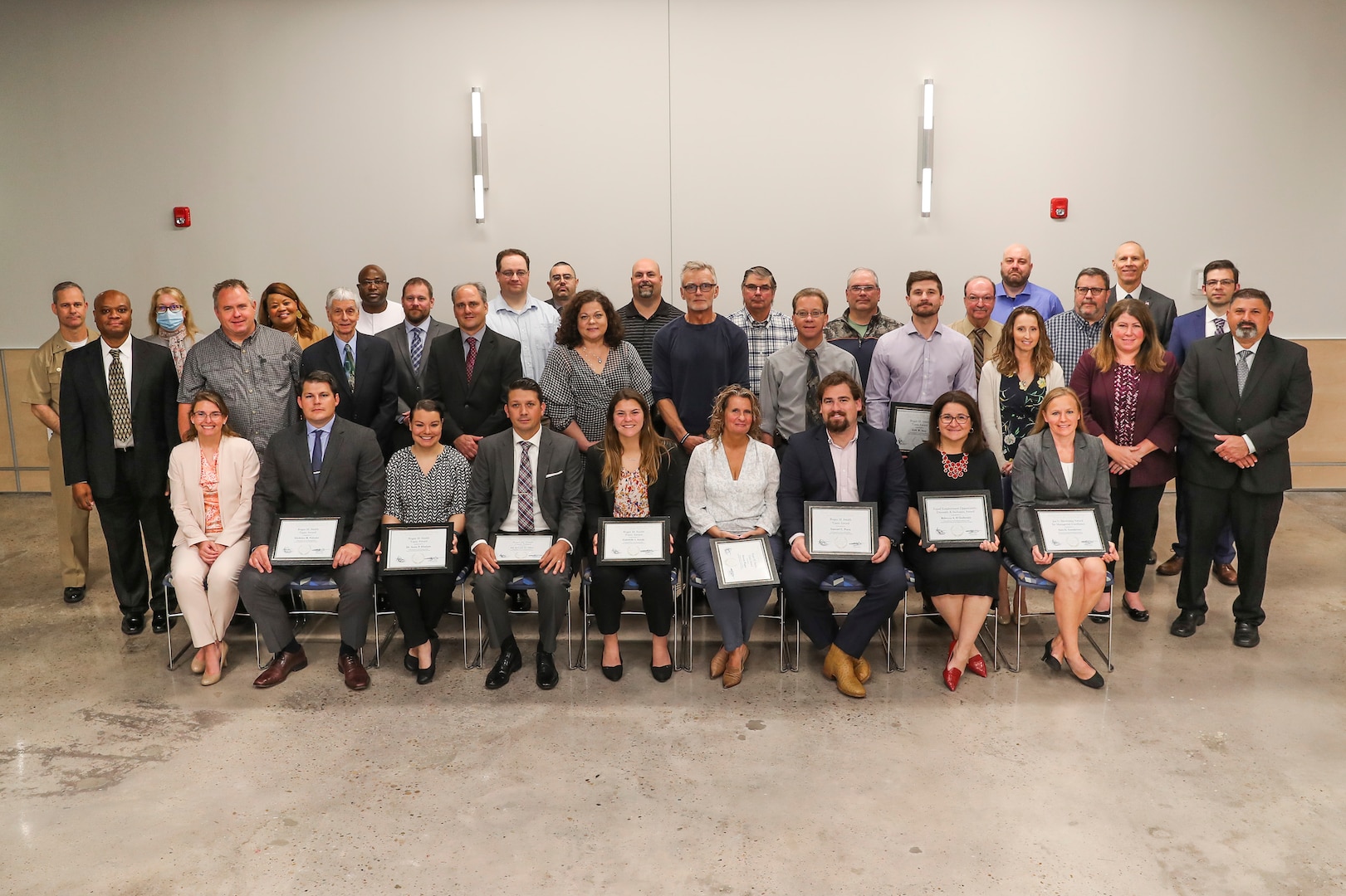 NSWC IHD employees who received Command Honorary Awards pose for a group picture.