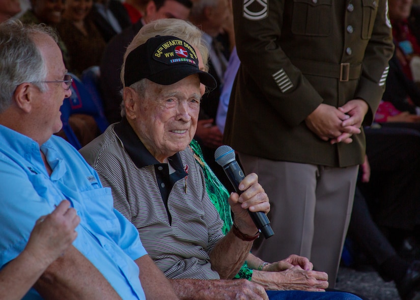 U.S. Army World War II Veteran, Pfc. Reid F. Clanton, speaks at a recognition ceremony in the historic Quadrangle of Joint Base San Antonio- Fort Sam Houston, Texas, May 16, 2022. U.S. Army North leaders paid special tribute to the service of Clanton during a ceremony awarding him long-overdue medals, which included the Bronze Star Medal at the U.S. Army North headquarters.(U.S. Army photo by Pfc. Gianna Elle Sulger)