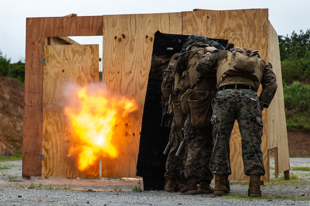 U.S. Marines with 3rd Battalion, 2nd Marines, detonate an explosive breach charge during a live-fire range at Camp Hansen, Okinawa, Japan, May 12, 2022. The training integrated raiding and demolition tactics to enhance the unit’s ability to breach obstructions and perform combat operations in an urban environment. 3/2 is deployed in the Indo-Pacific under 4th Marine Regiment, 3d Marine Division.