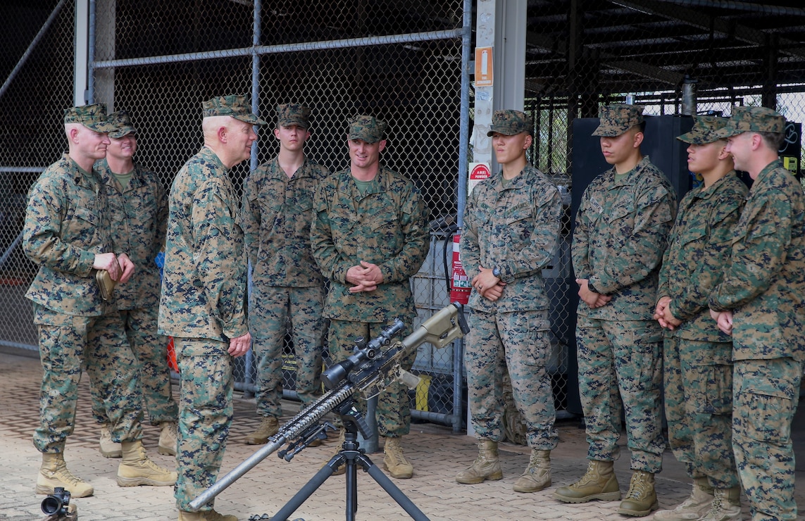 The 38th Commandant of the Marine Corps, Gen. David H. Berger and 18th Sergeant Major of the Marine Corps, discusses with the Marines of Marine Rotational Force-Darwin (MRF-D) the weapon capabilities that are being used during the training exercise, Darwin, Australia, April 14, 2022. MRF-D has been a crucial means of strengthening our interoperability with the Australian Defence Force. Now in its 11th year, Marines are still maintaining our close partnership with the ADF at all levels. (U.S. Marine Corps photo by Sgt. Kathryn M. Adams)