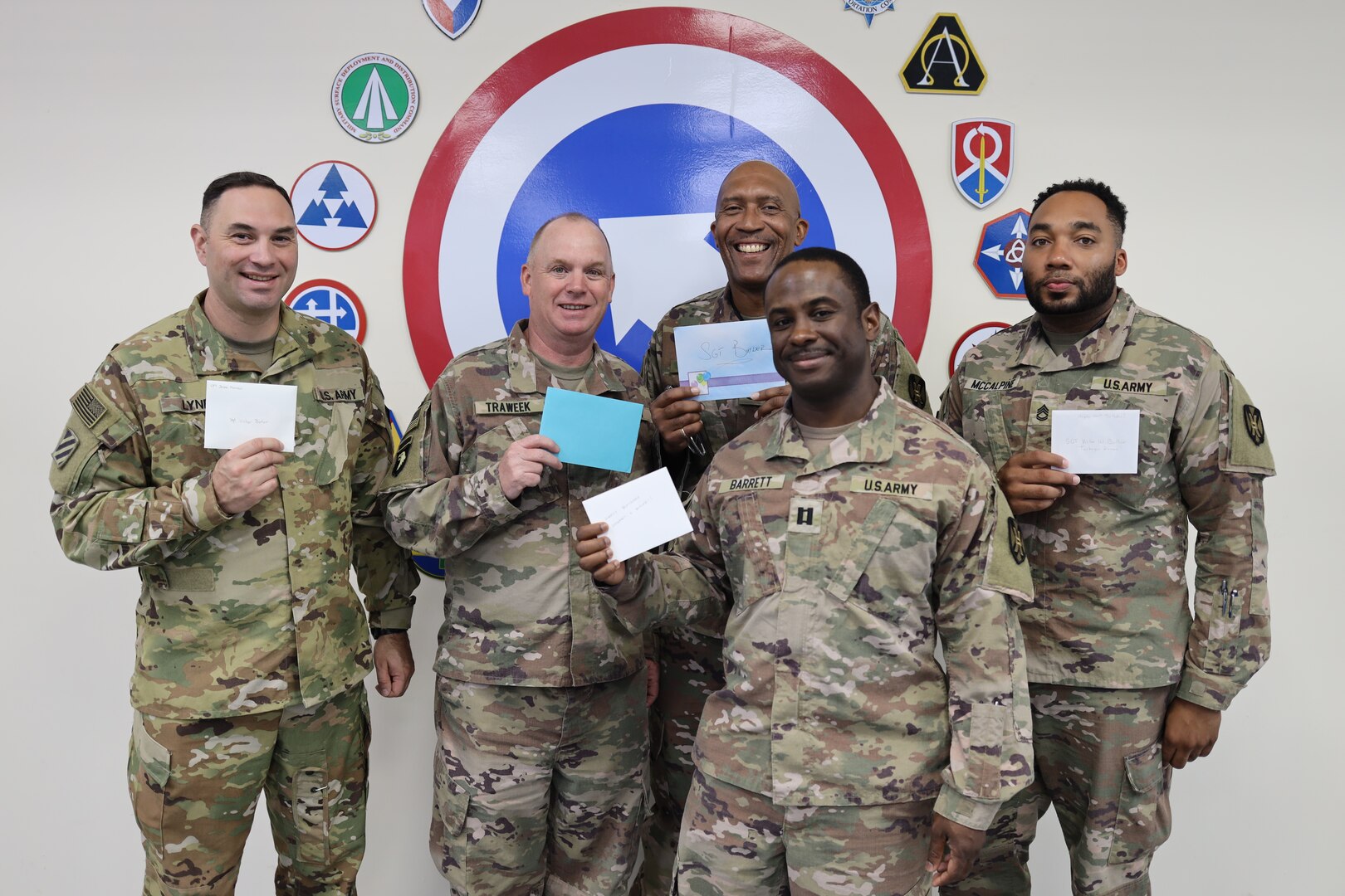 Five of the 135 Soldiers of the 135th Expeditionary Sustainment Command, Alabama National Guard, hold their birthday cards for one of the last known surviving Tuskegee Airman, Sgt. Victor Butler, who turns 100 May 21, 2022. Left to right, Sgt. 1st Class Brian Lynd, Lt. Col. Joel Traweek, Sgt. 1st Class Willie Vandiver, Capt. Jeremy Barrett, and Sgt. 1st Class Carnard McCalpine.