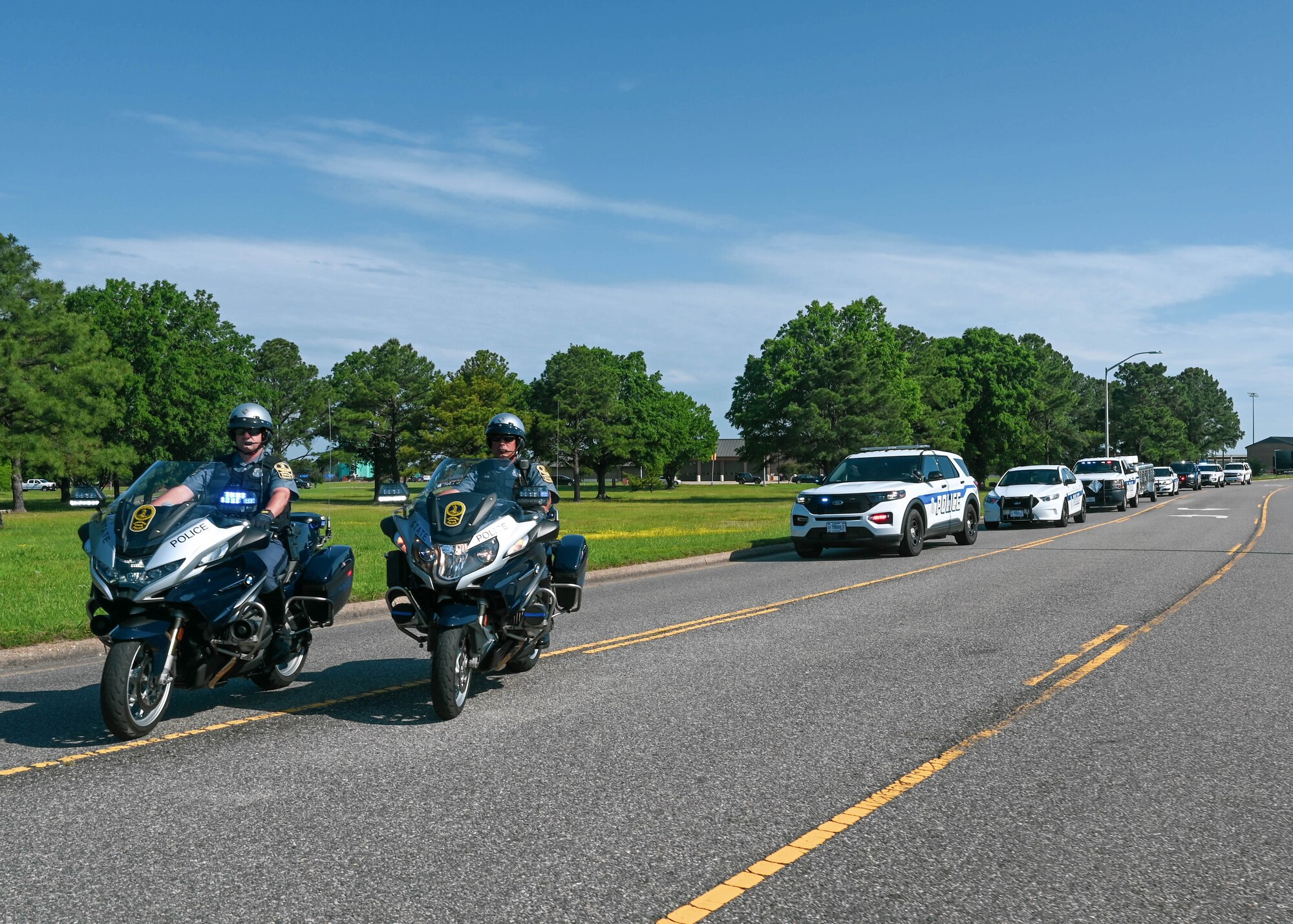 Senior Trooper Jordan Gough (left) and Senior Trooper Raymond Speas with the Virginia State Police, lead a motorcade on Langley Air Force Base as part of the opening ceremony of National Police Week at Joint Base Langley-Eustis, Virginia, May 16, 2022.