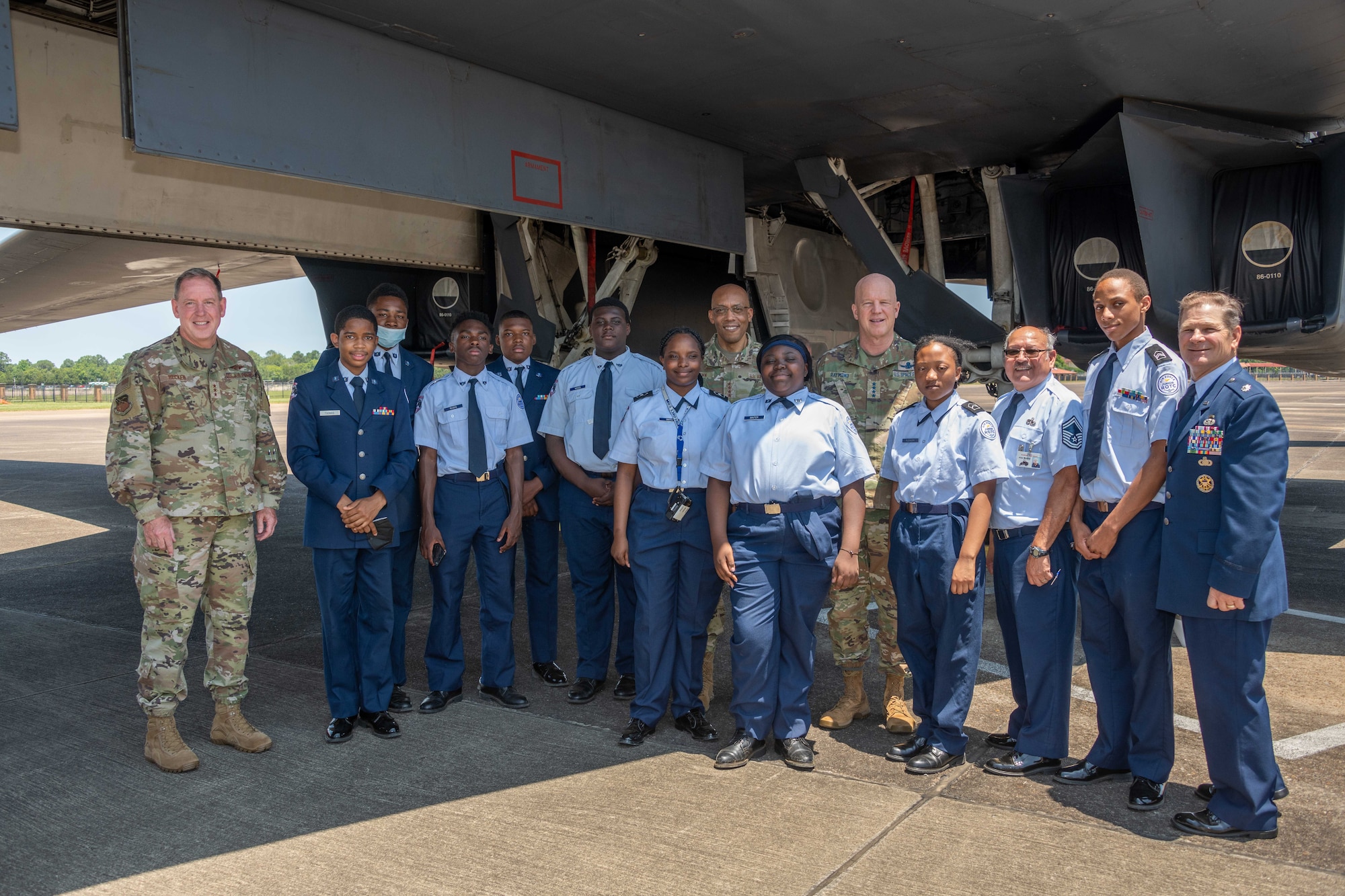 Air Force Chief of Staff Gen. CQ Brown, Jr., U.S. Space Force Chief of Space Operations Gen. John W. “Jay” Raymond, and Air University Commander and President Lt. Gen. James Hecker pose with students in the Air Force JROTC detachment at Selma’s Southside High School during the students’ tour of a B-1B Lancer from Dyess Air Force Base, May 12, 2022. Raymond and Air Force Chief of Staff Gen. CQ Brown, Jr., were at Maxwell to provide keynote addresses to the 68th National Security Forum. Air Force Global Strike Command’s B-1 bomber was at Maxwell for “Project Tuskegee,” an engagement with high school students attending STEM focused magnet schools and JROTC units in an effort to increase diversity in STEM and aviation related fields.