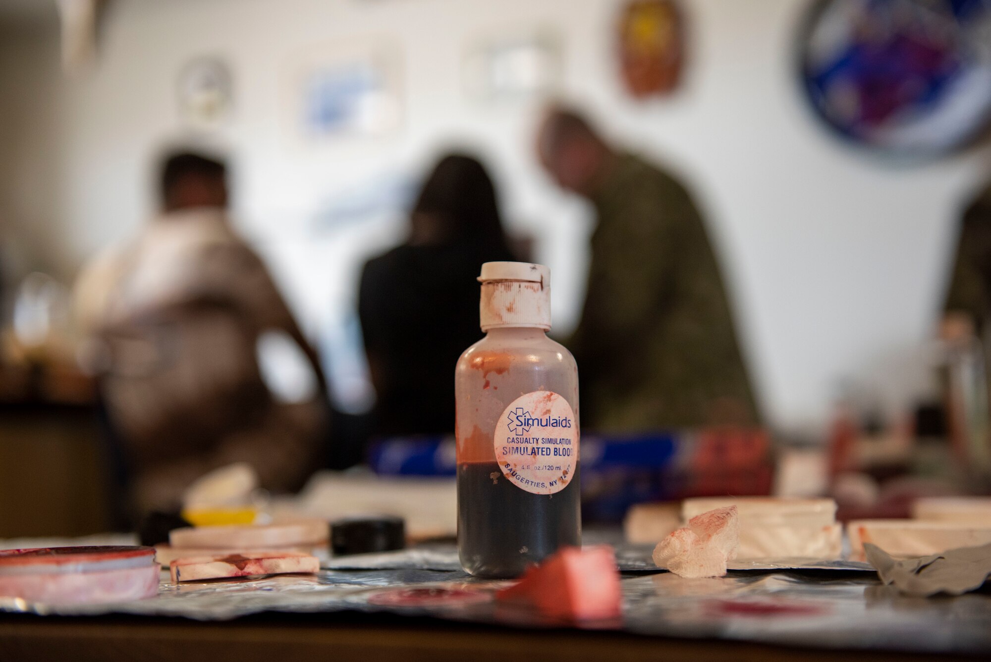 A bottle of simulated blood sits on a table