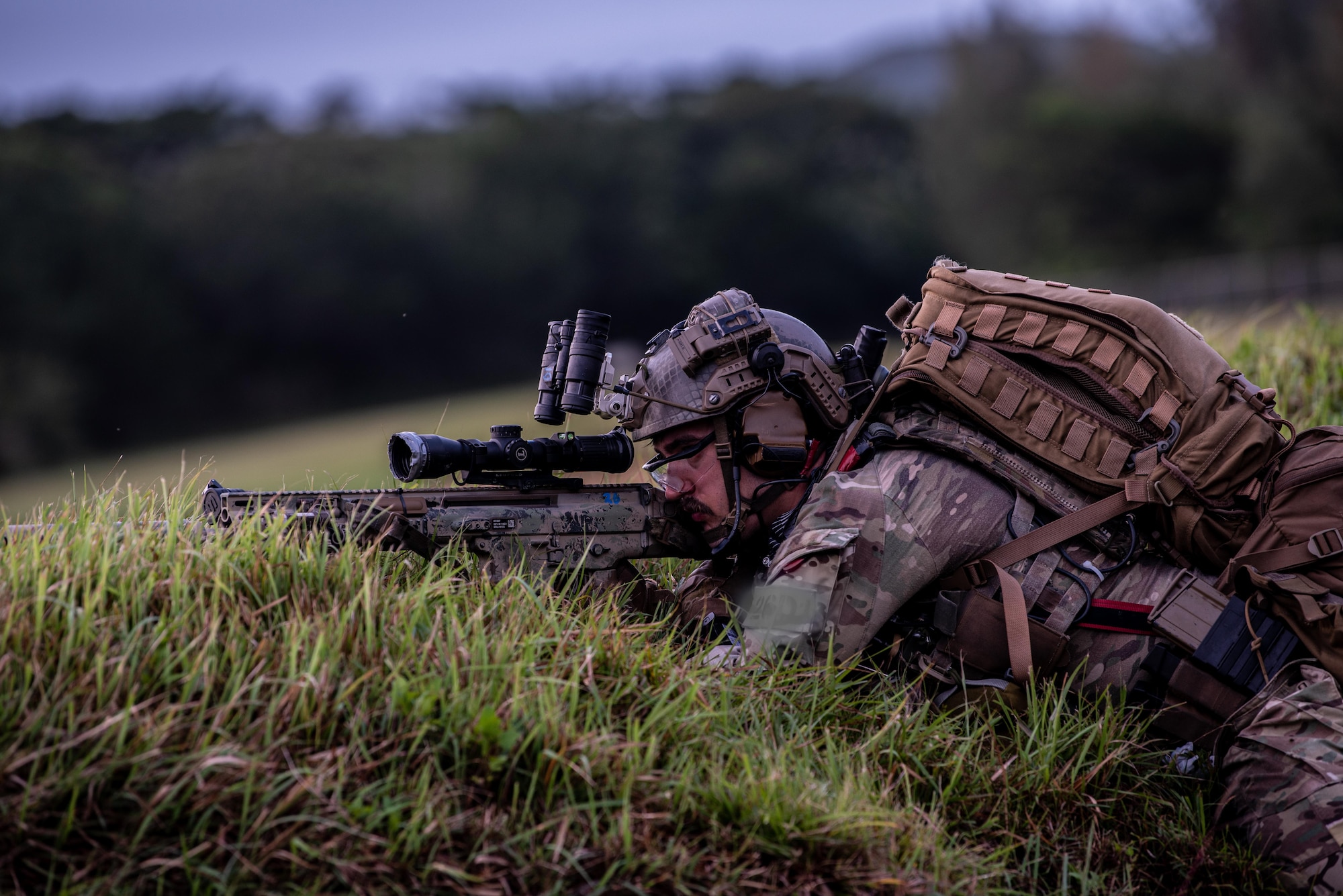 Soldier aims weapon.