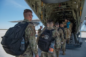 U.S. Air Force Airmen assigned to the 366th Fighter Wing board a C-130J Hercules, assigned to the 317th Airlift Wing, Dyess Air Force Base, Texas, as part of Exercise Raging Gunfighter at Mountain Home Air Force Base, Idaho, May 17, 2022. Raging Gunfighter is an Air Combat Command (ACC) exercise to prepare the 366th Fighter Wing to operate as a lead wing in a remote environment for future Agile Combat Employment (ACE) operations around the world. (U.S. Air Force Photo by Airman 1st Class Alexandria Byrd)