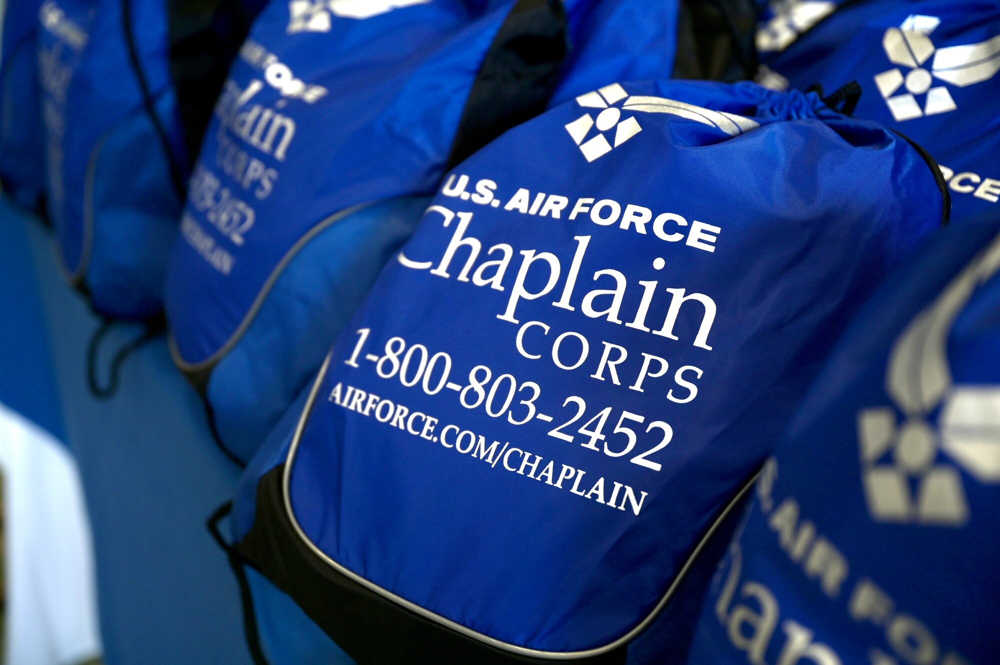 A 647th Air Base Group Chaplain Corps “goodie bag” sits on a table before being picked up by visiting local religious leaders from around the island of Oahu during a Cultural Religious Leader Engagement event at Joint Base Pearl Harbor-Hickam, Hawaii, May 12, 2022. The 647th ABG Chaplain Corps held the event to strengthen ties between JBPHH and the local religious community. (U.S. Air Force photo by 1st Lt. Benjamin Aronson)